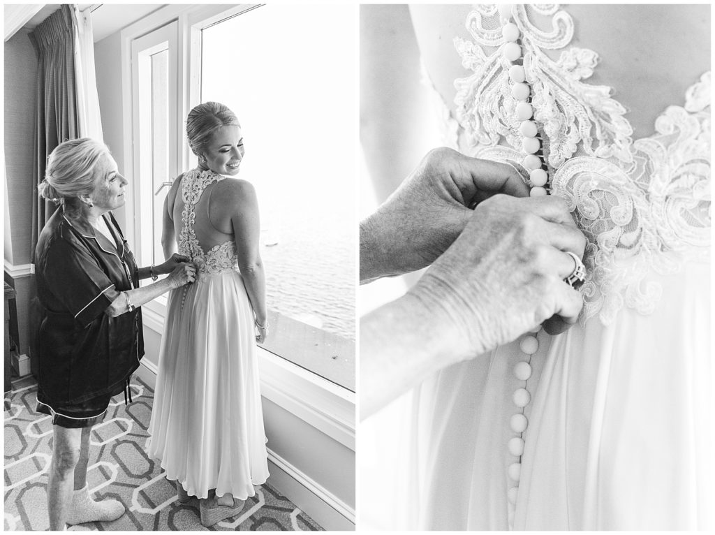 Mom zipping up bride's wedding dress