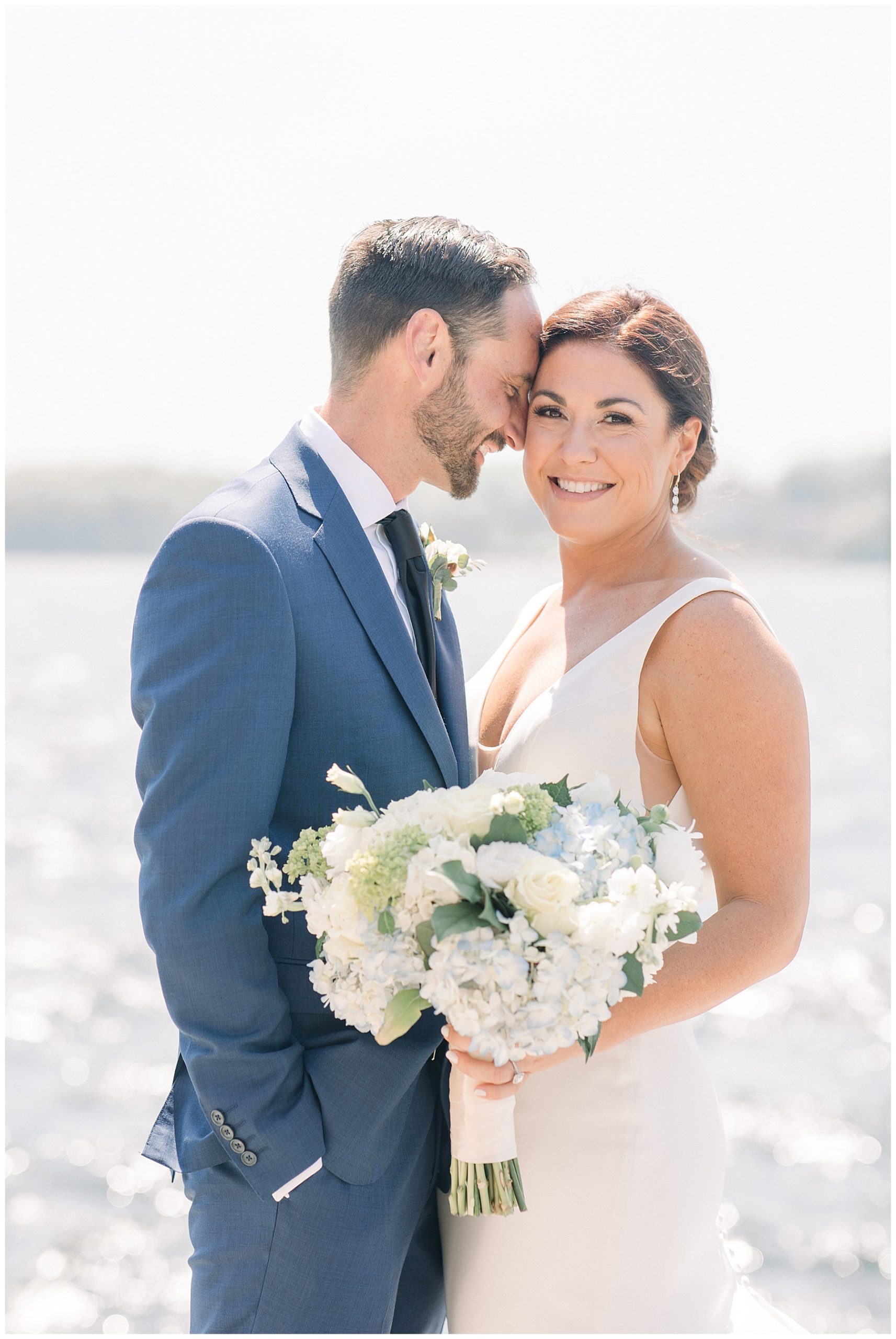 bride + groom steal a few moments together before wedding ceremony in Rhode Island