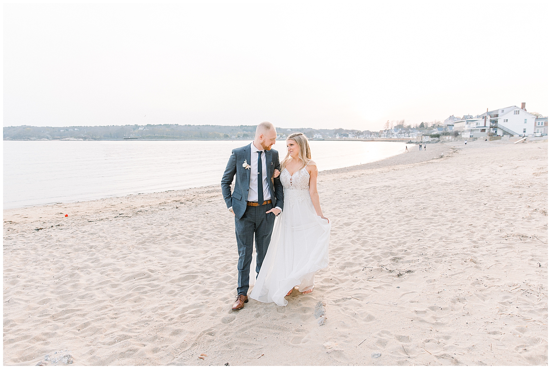 bride and groom walk on beach at Beauport Hotel