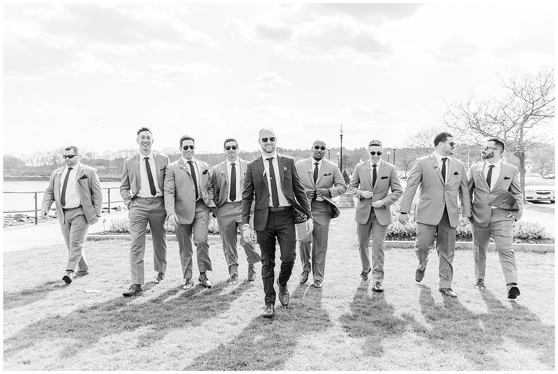 groomsmen walk on beach in Gloucester MA