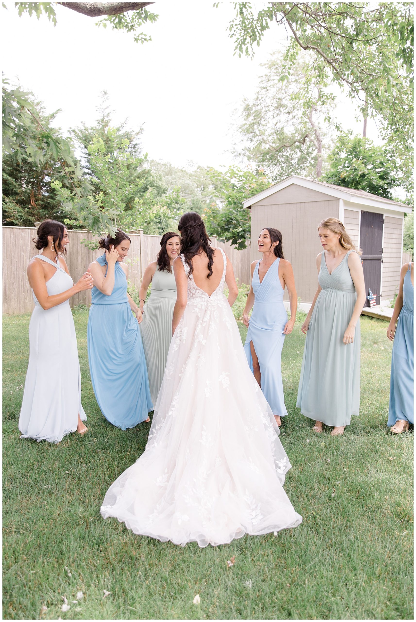 bride during first look with bridesmaids by Stephanie Berenson Photography