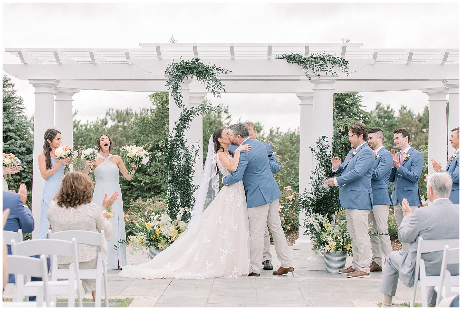 Husband and wife share first kiss by Stephanie Berenson Photography