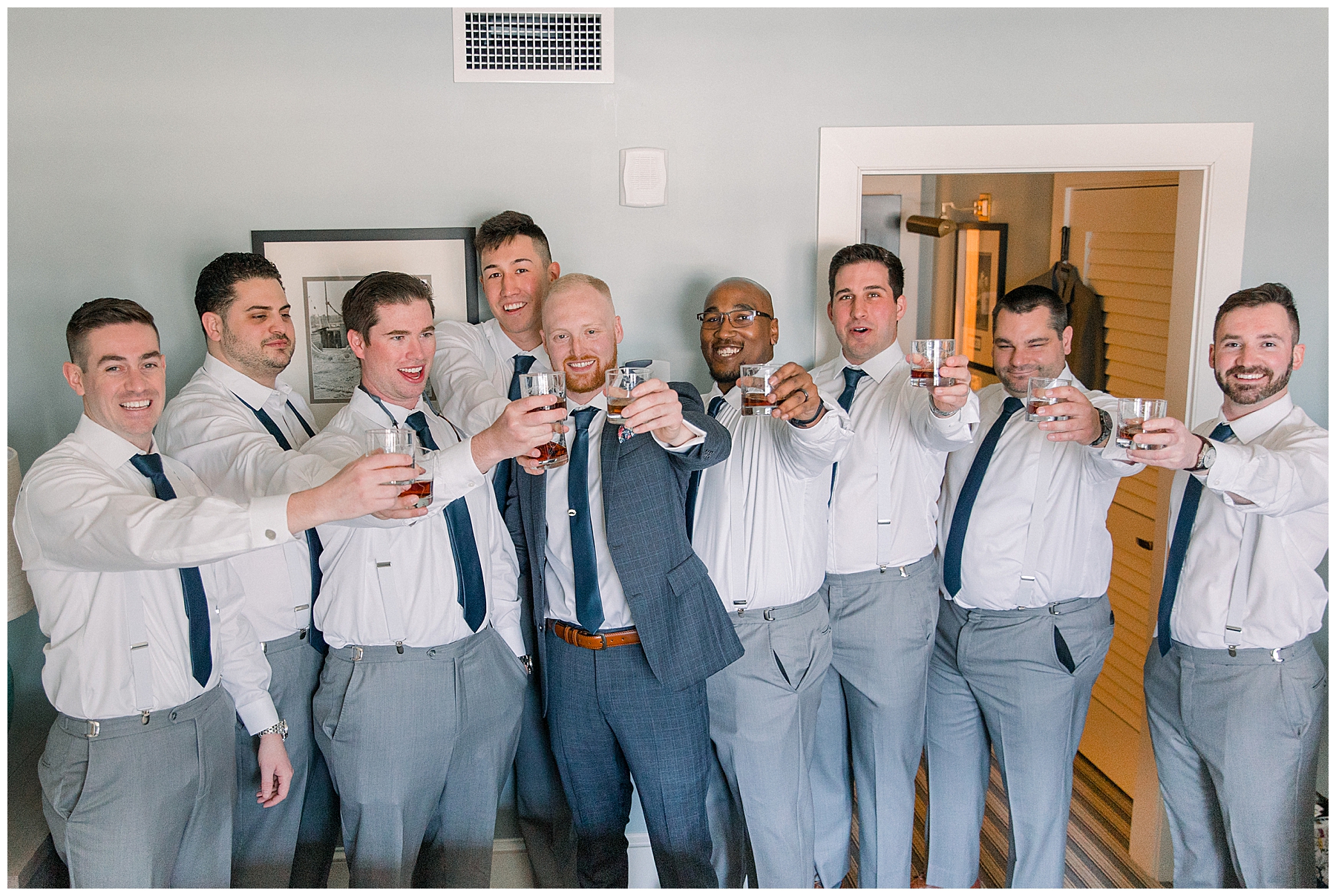 groomsmen cheers and have a toast before wedding ceremony at Beauport Hotel in Gloucester MA