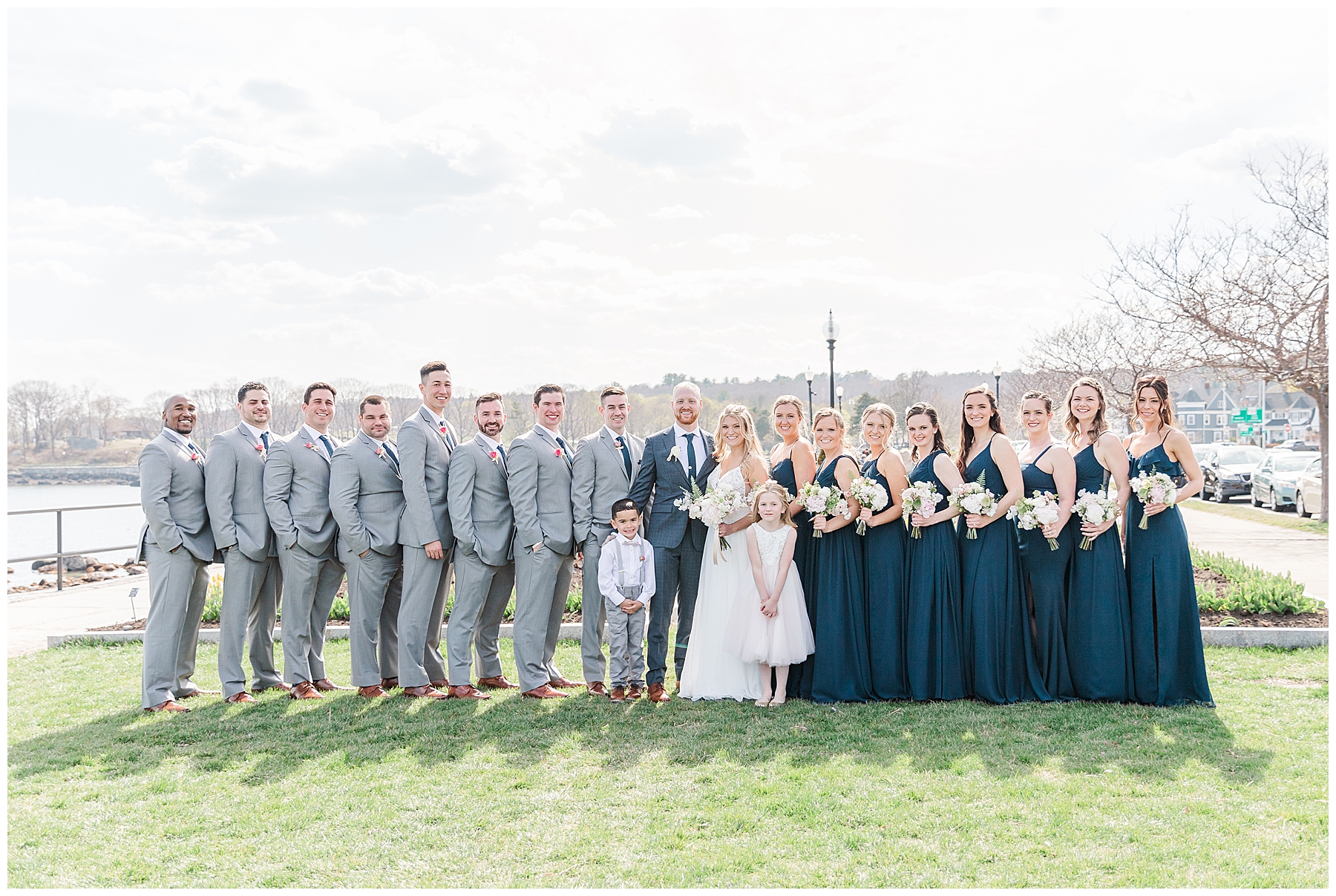 bridal party pictured in green landscape in Gloucester MA