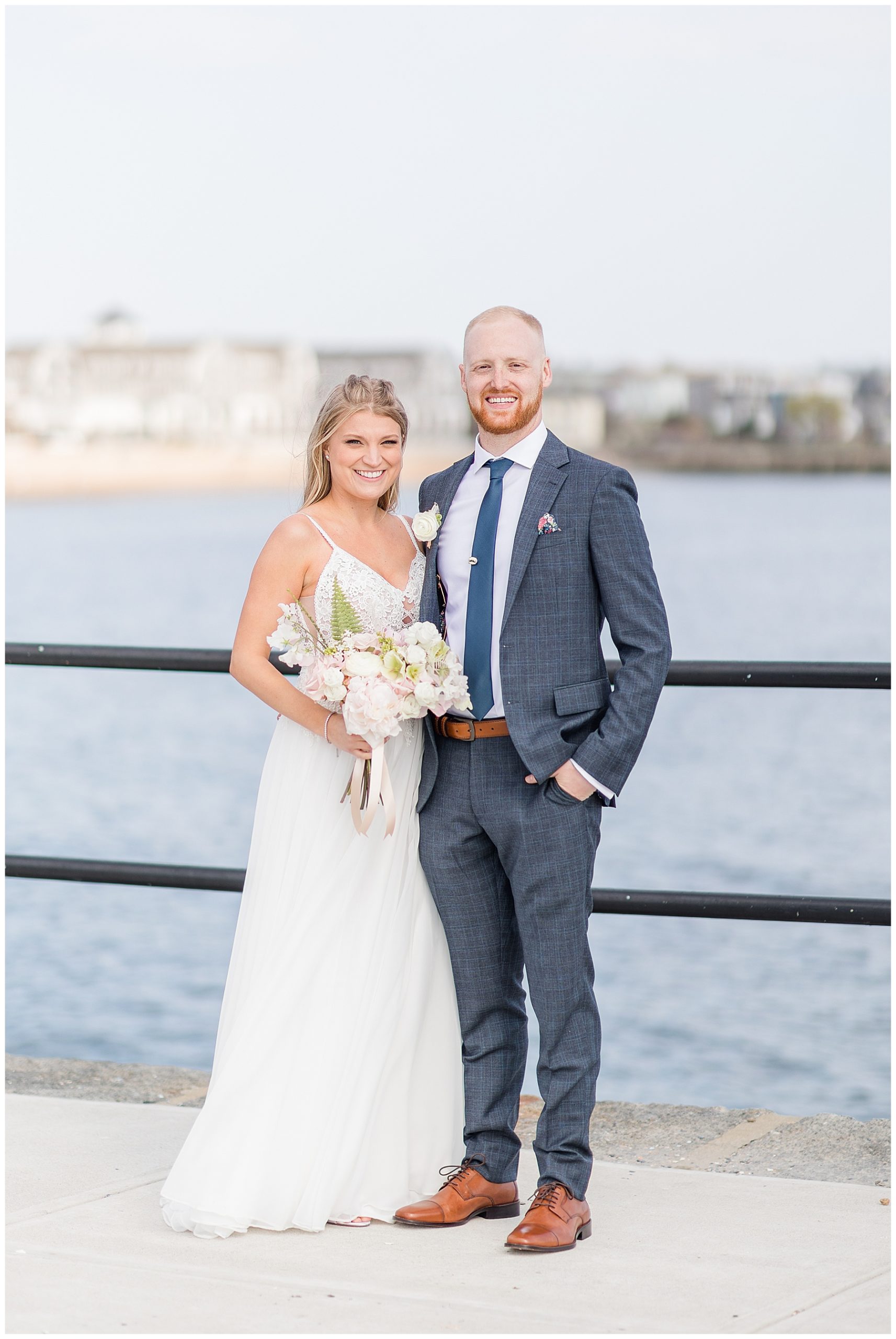 Bride + Groom stand by water during Beauport Hotel Gloucester Wedding captured by Chelsea Morton Photography