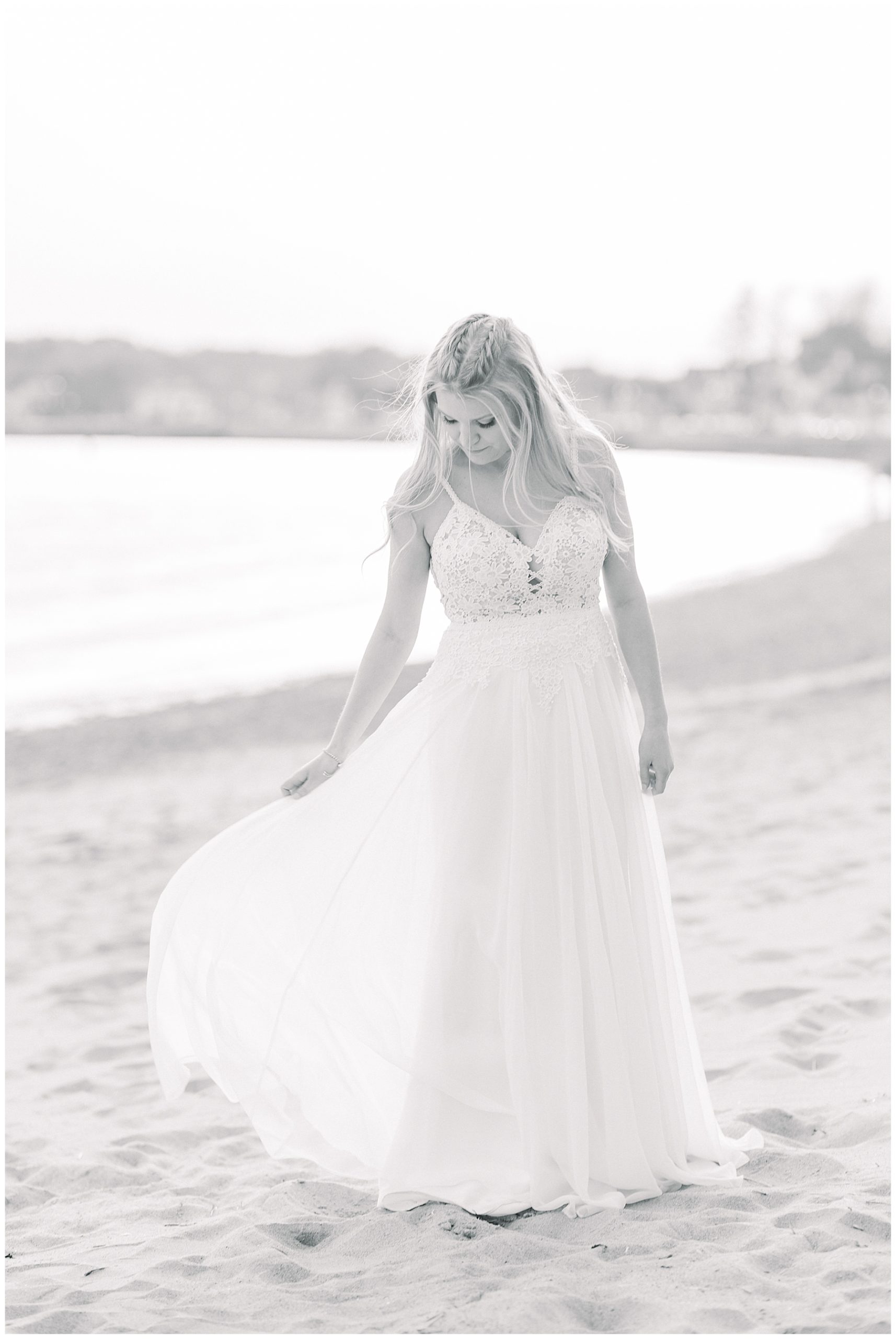 bride in wedding dress on beach in Gloucester MA near the Beauport Hotel