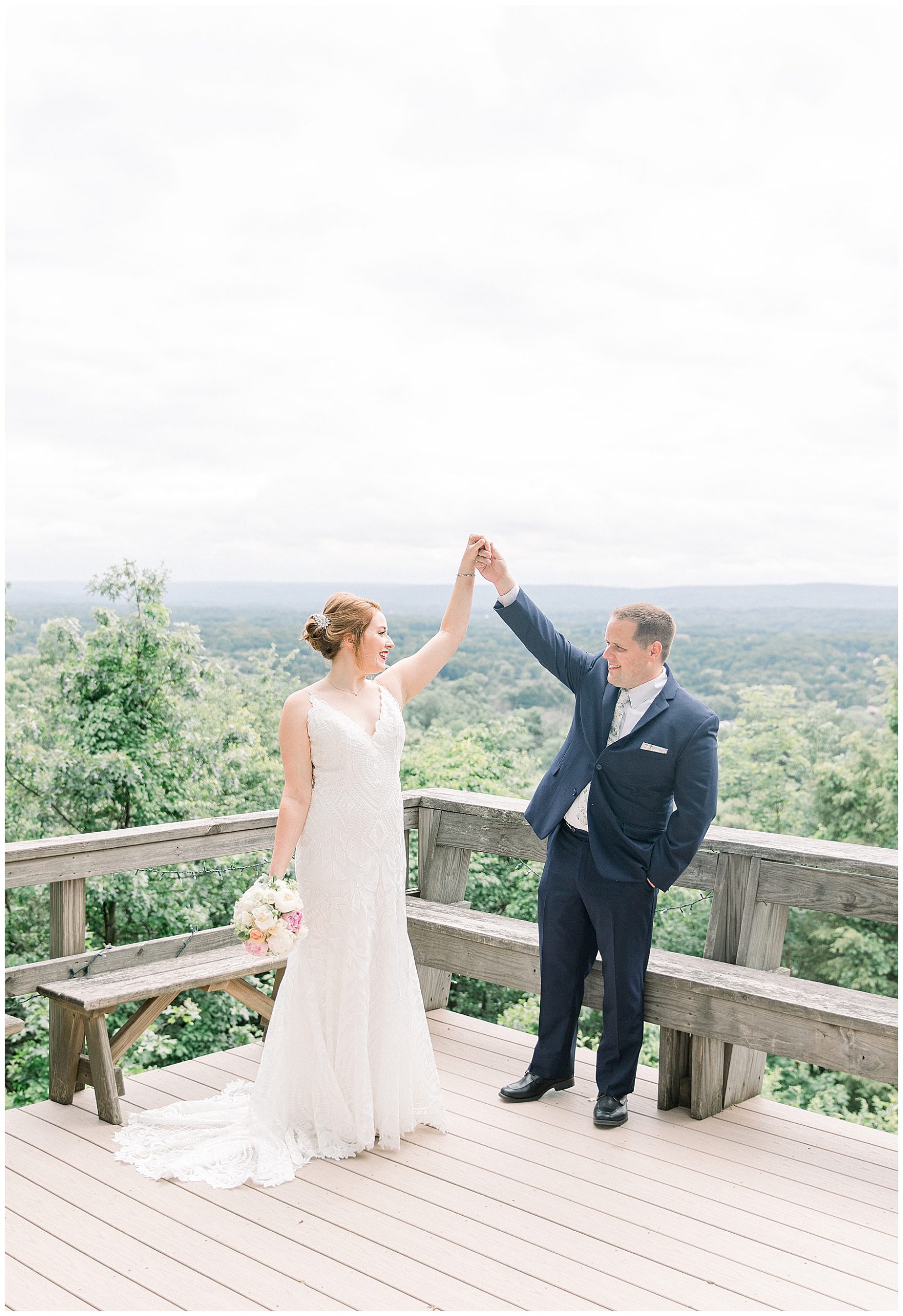 groom twirls bride during CT wedding photos