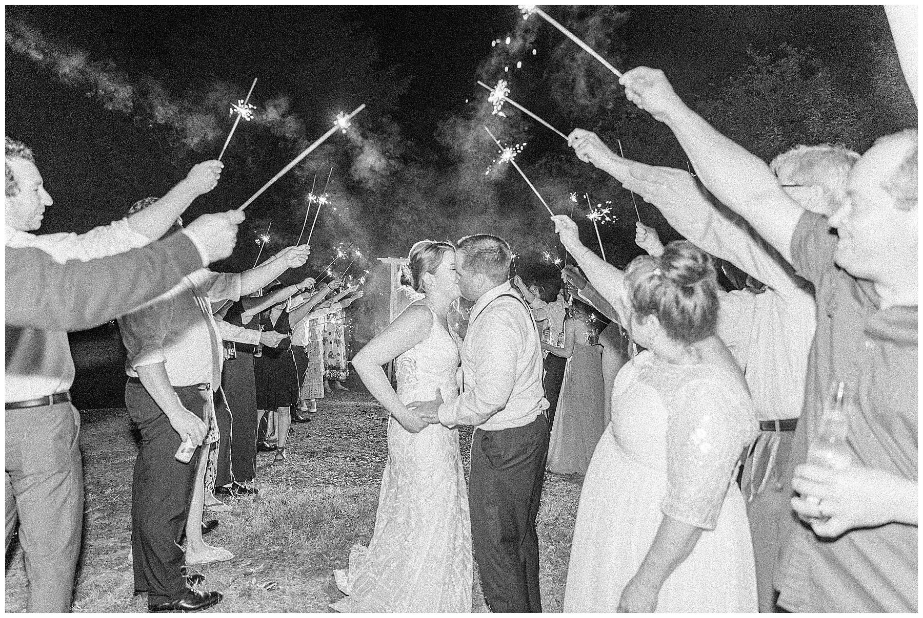 newlyweds leave wedding reception during sparkler exit