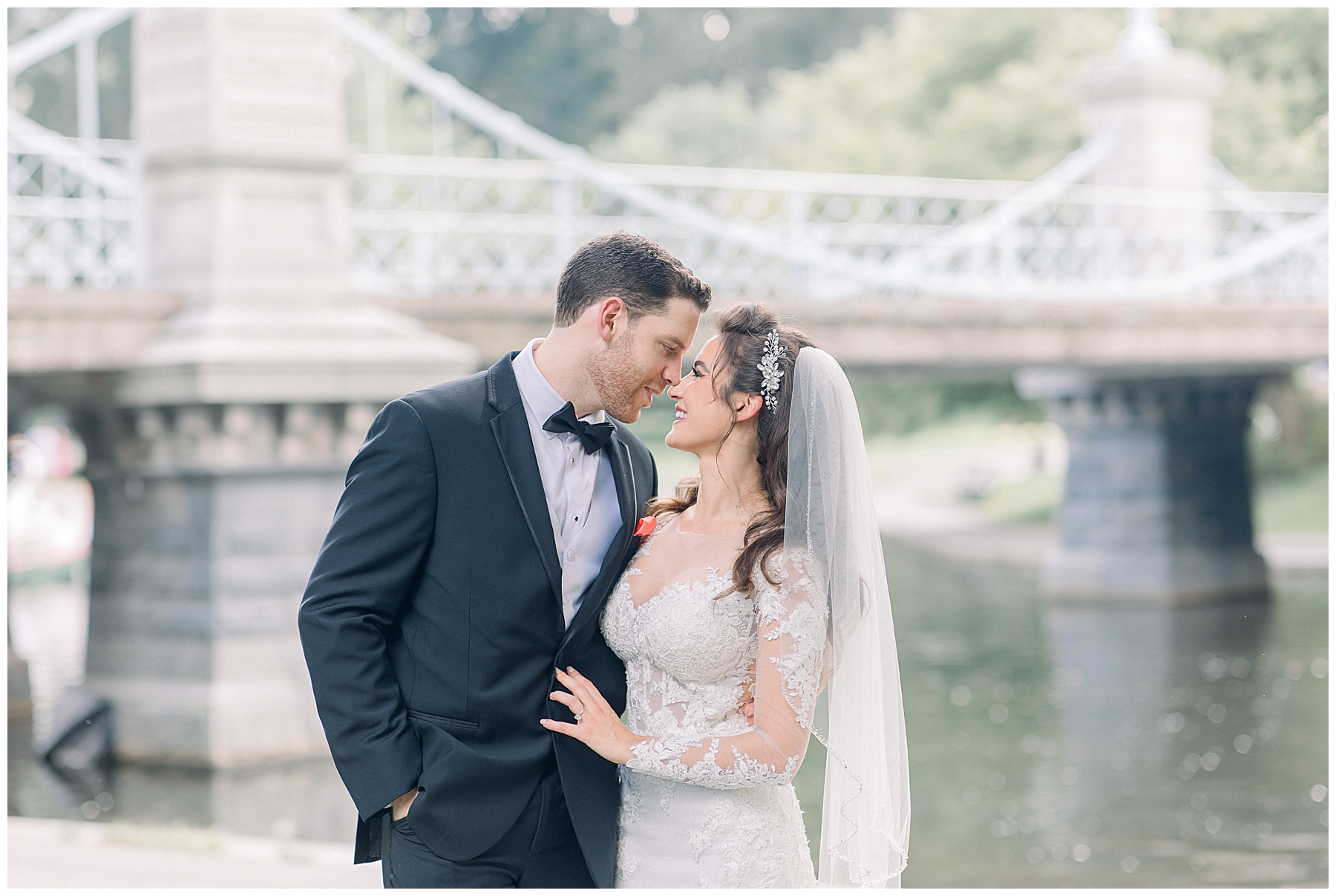 couple lean in close for wedding day portraits