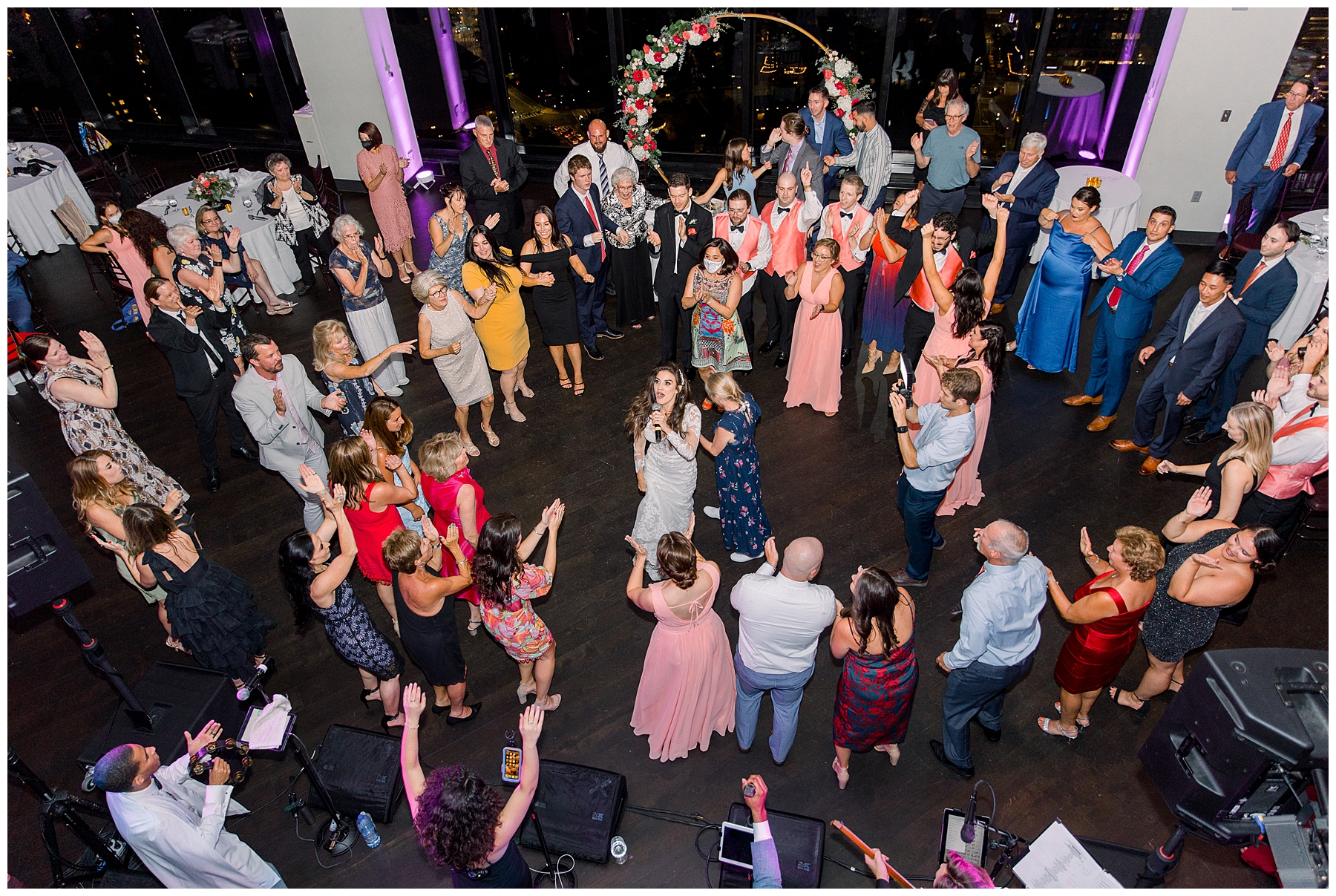 wedding guests celebrate newlyweds on the dance floor of the State Room in Boston MA