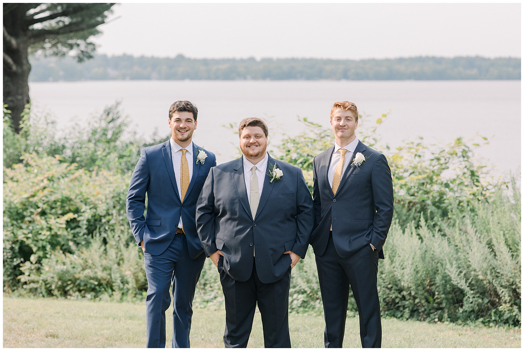 groom standing with groomsmen at wedding