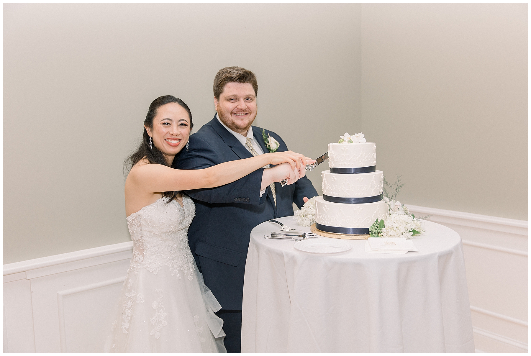 couple cut their wedding cake 