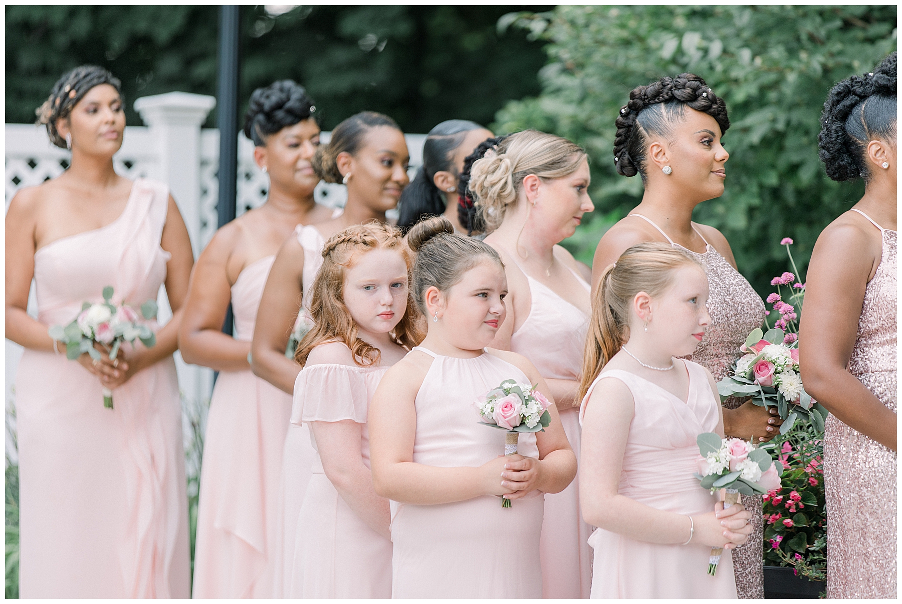 bridesmaids and flower girls in petal pink dresses