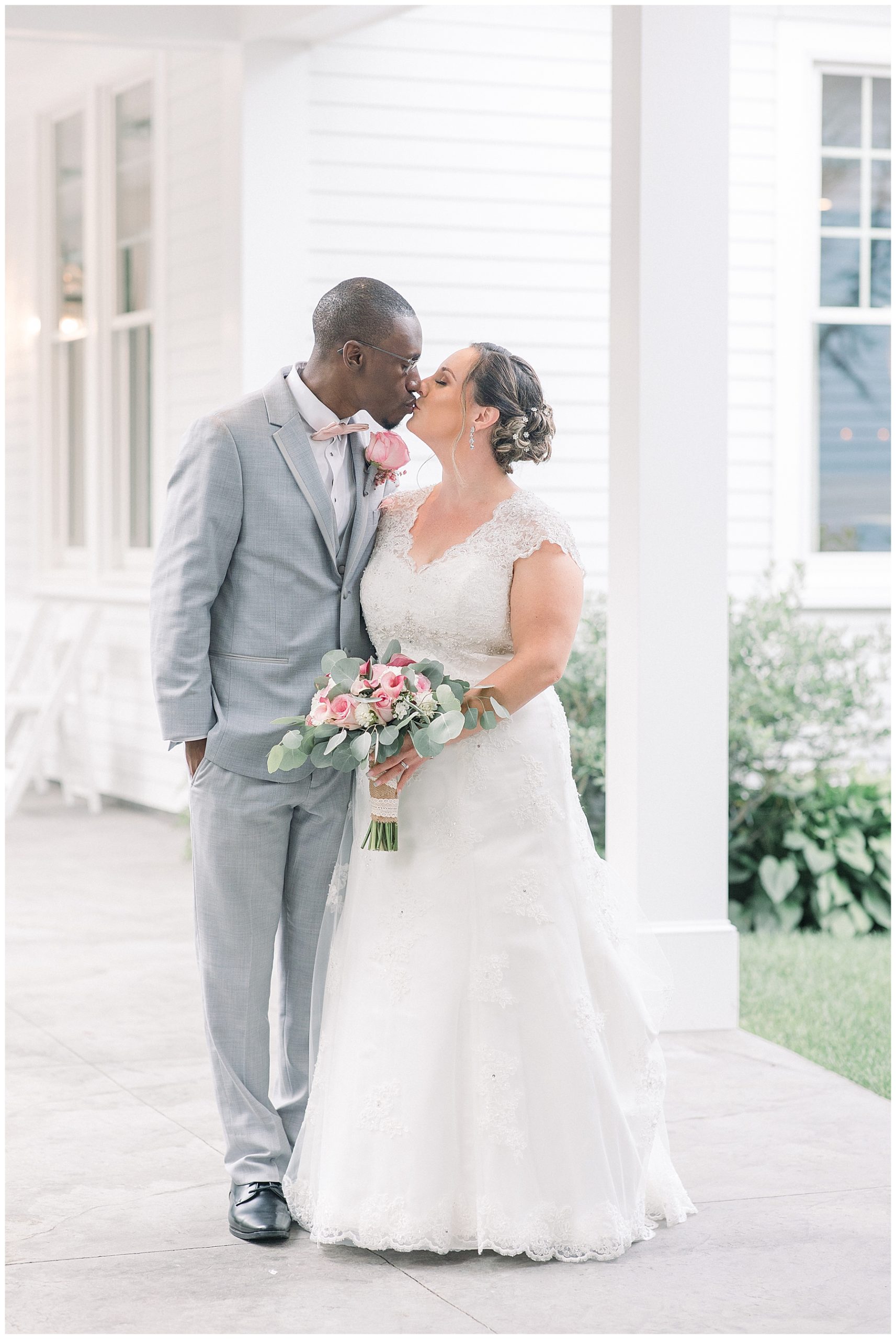 newlyweds kiss at the Saphire estate in Sharon MA