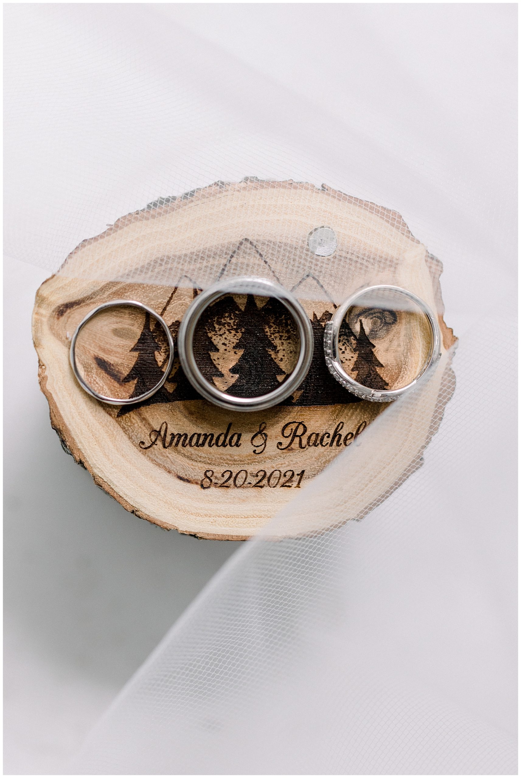 wedding rings on engraved wood