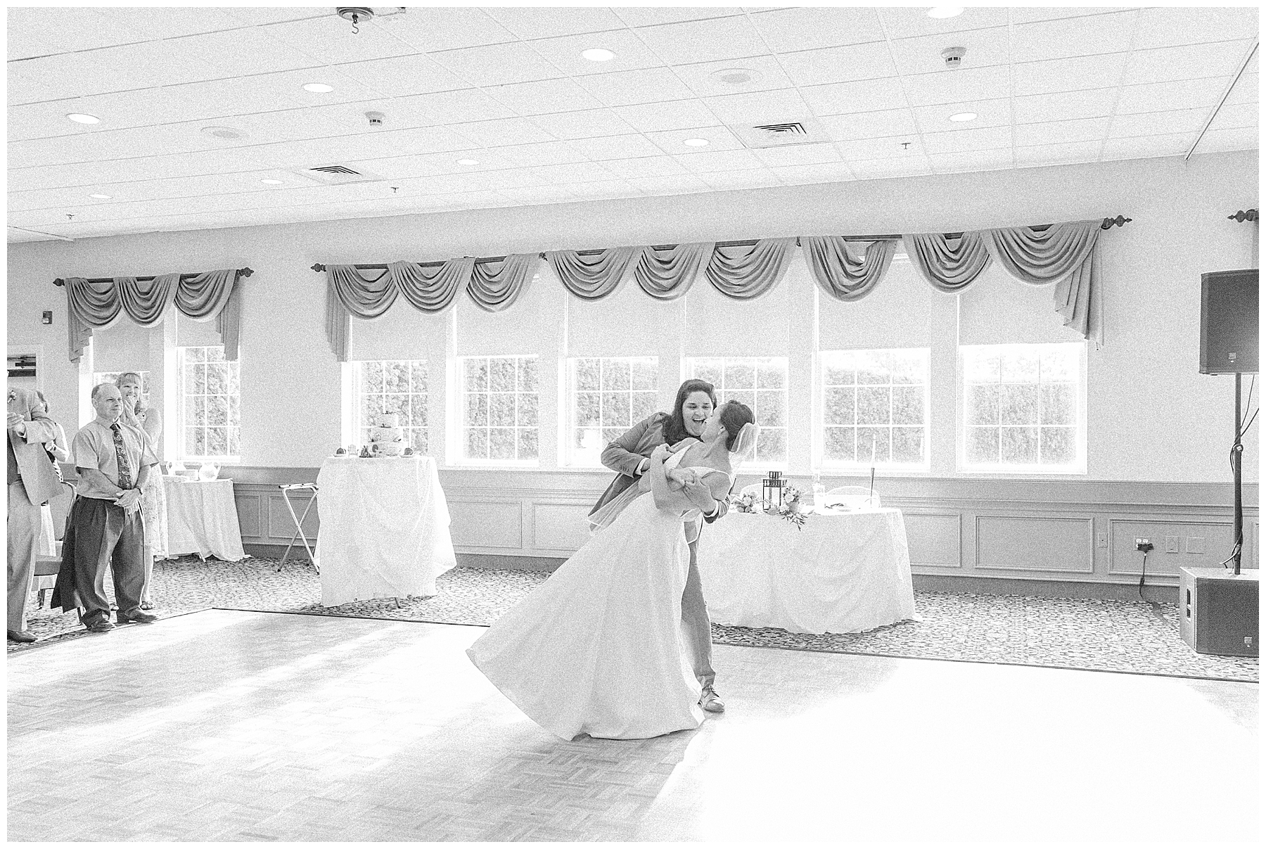 newlyweds share first dance at wedding reception