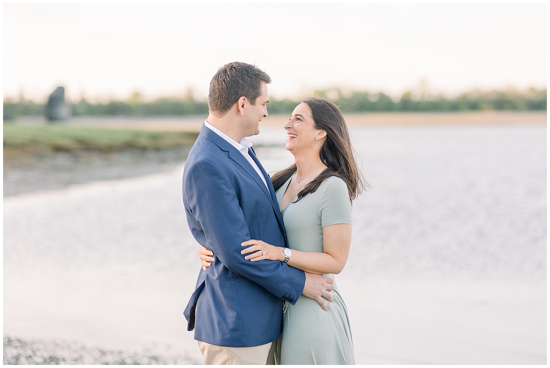 couple looks at each other candidly during Boston MA Engagement photos