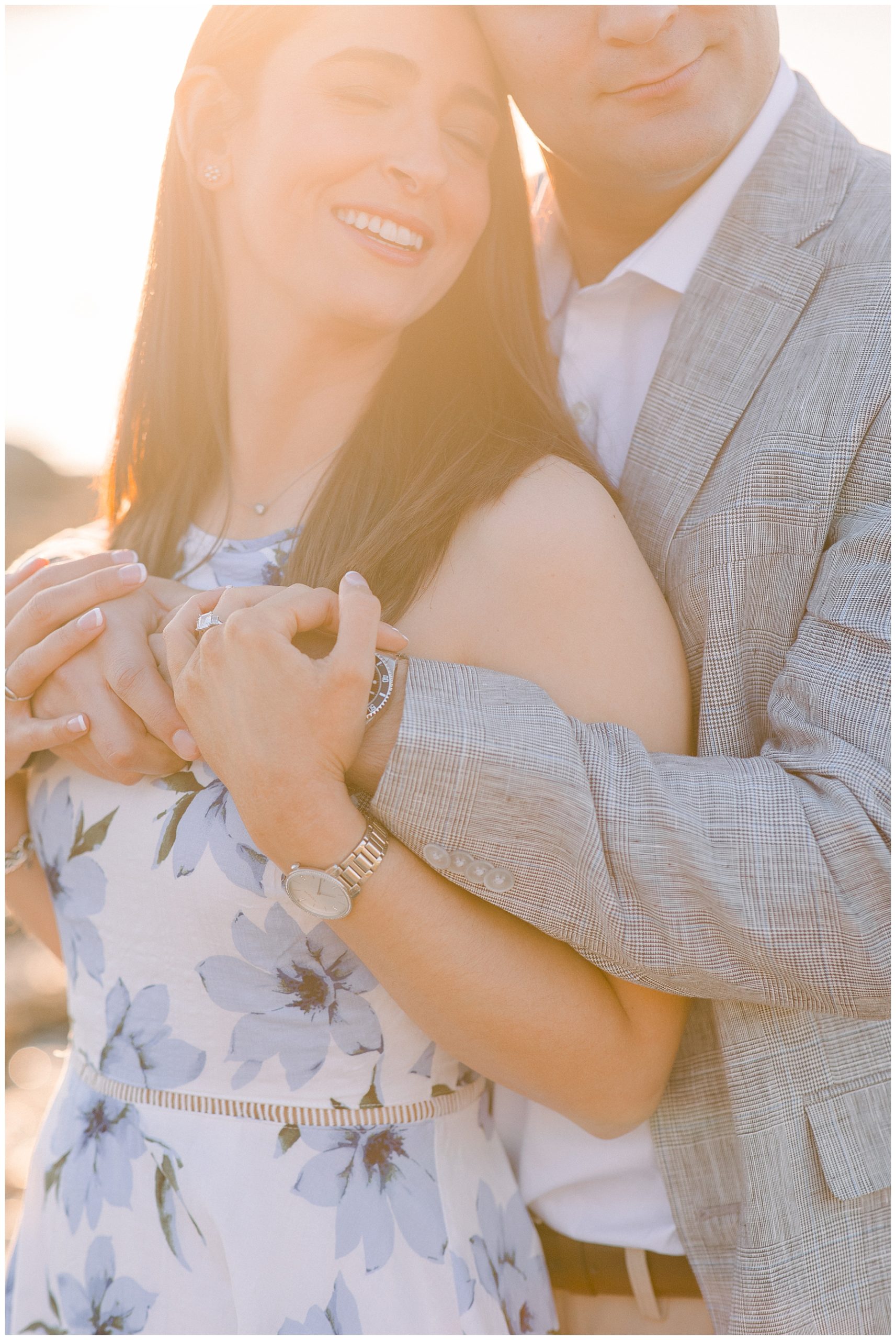 couple during engagement session with romantic glow from the sun 