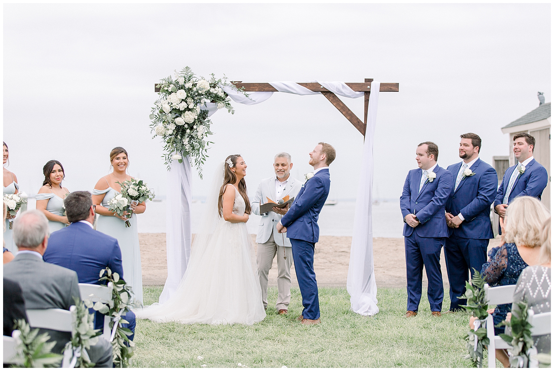 couple laugh at the alter during Shining Tides Wedding ceremony