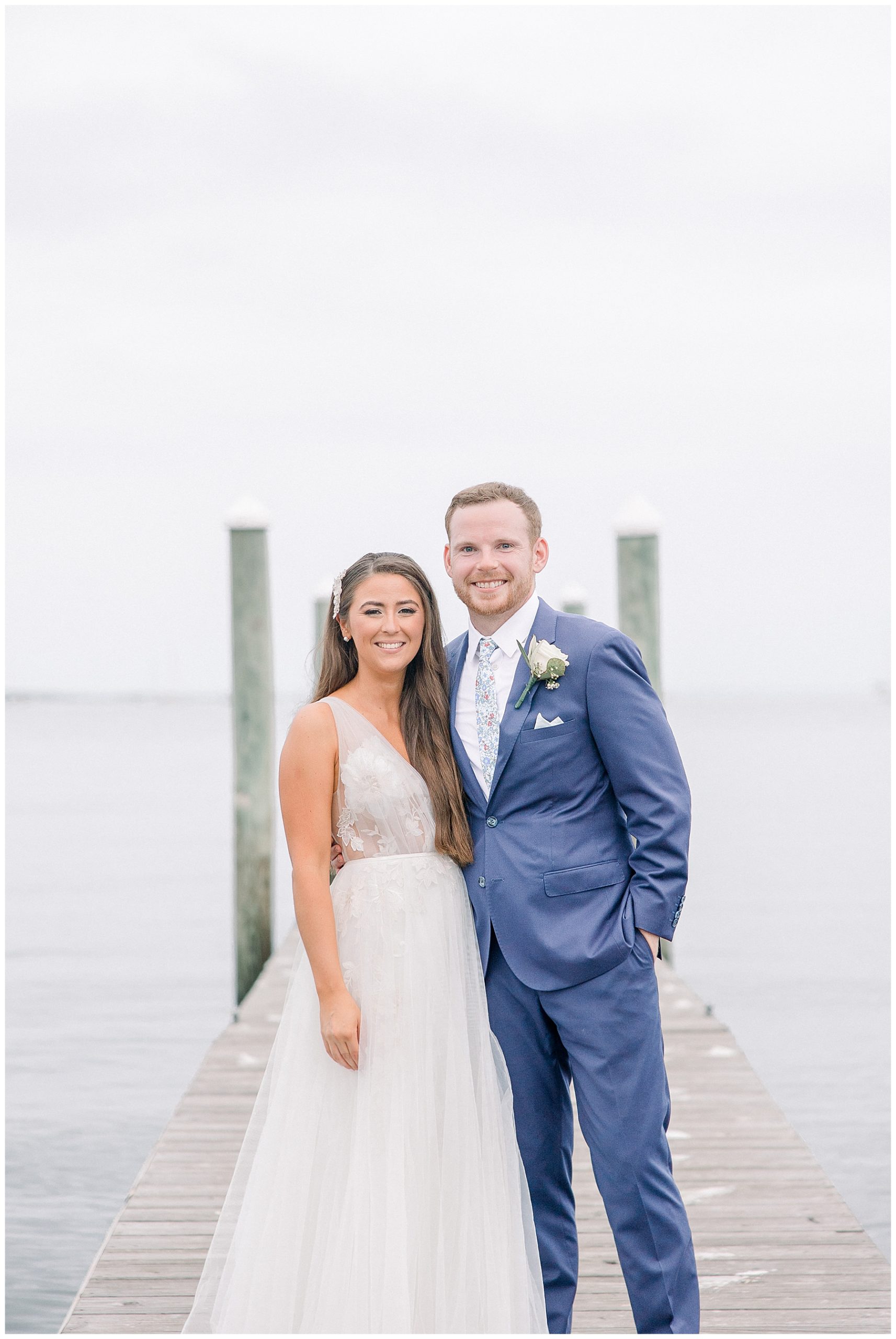bride and groom portraits by the water