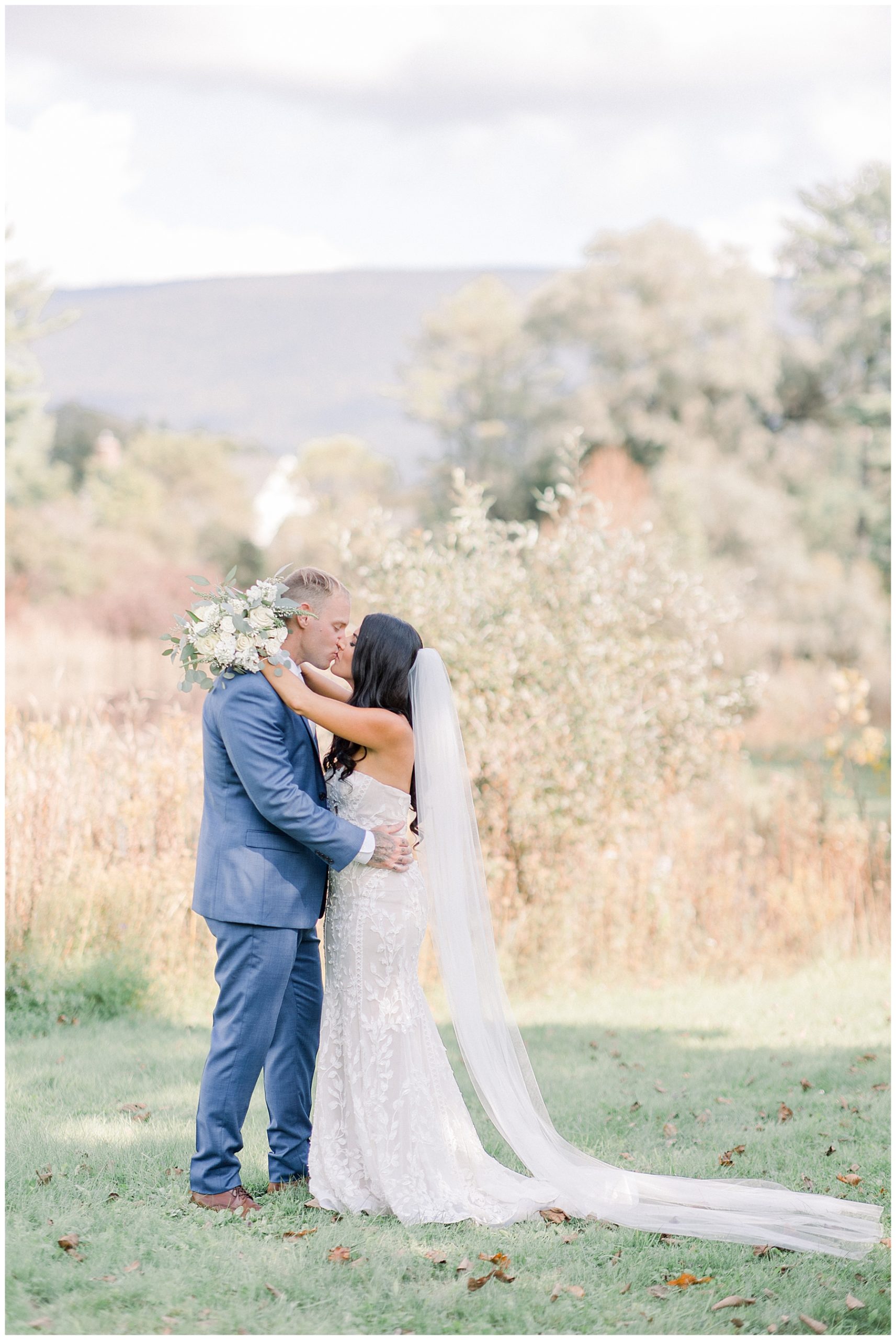 couple kisses before Vermont wedding at Kimpton Taconic Hotel