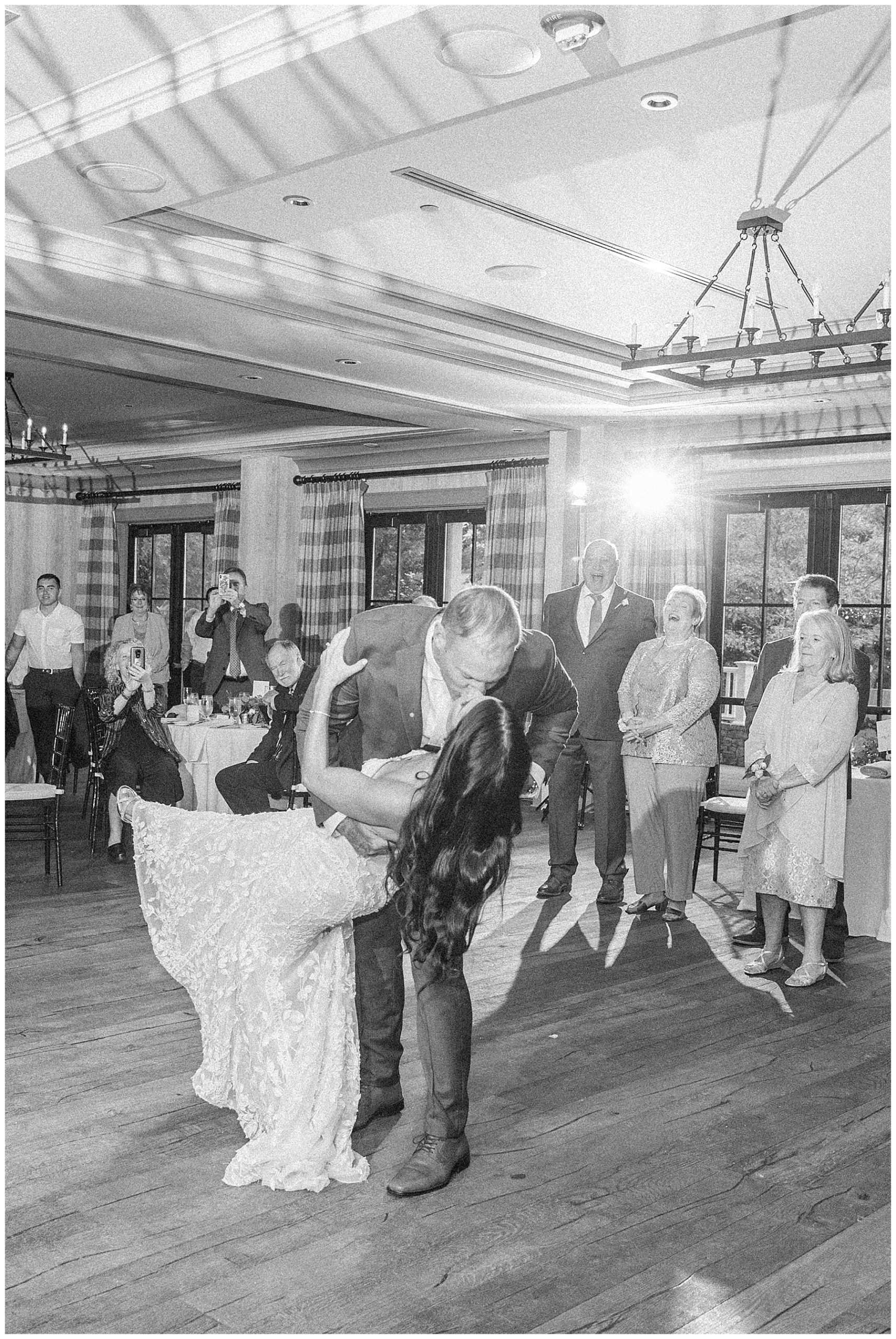 husband dips his bride at wedding reception in Kimpton Taconic Hotel in Vermont