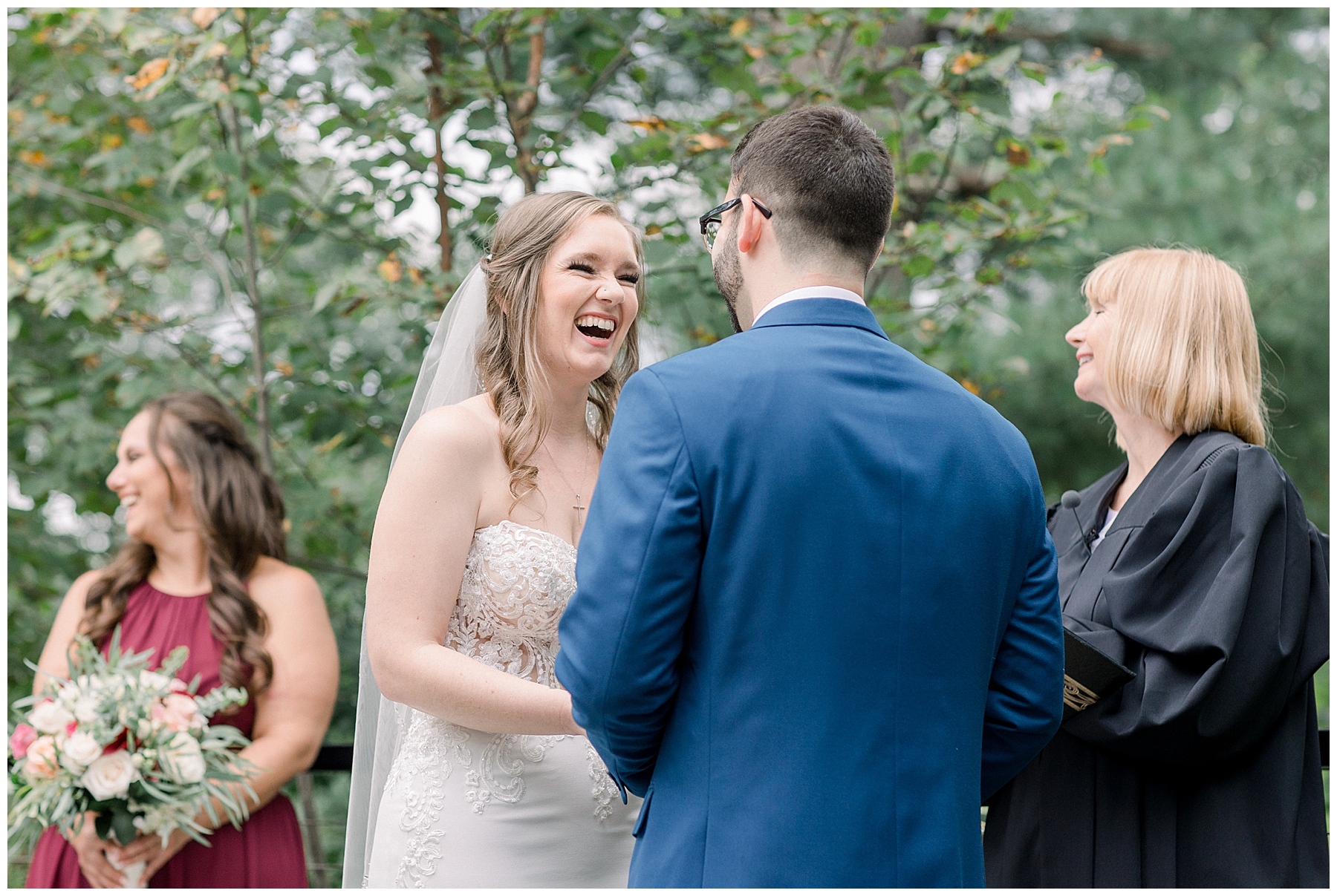 bride laughs with her future husband during ceremony