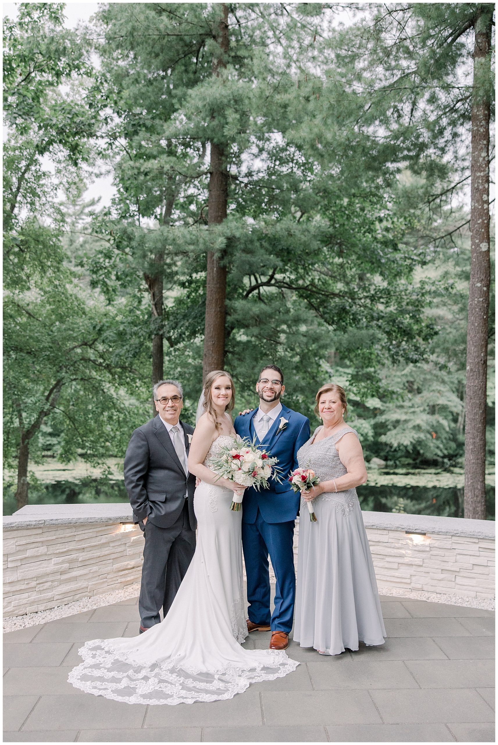 bride and groom portraits with family after wedding ceremony