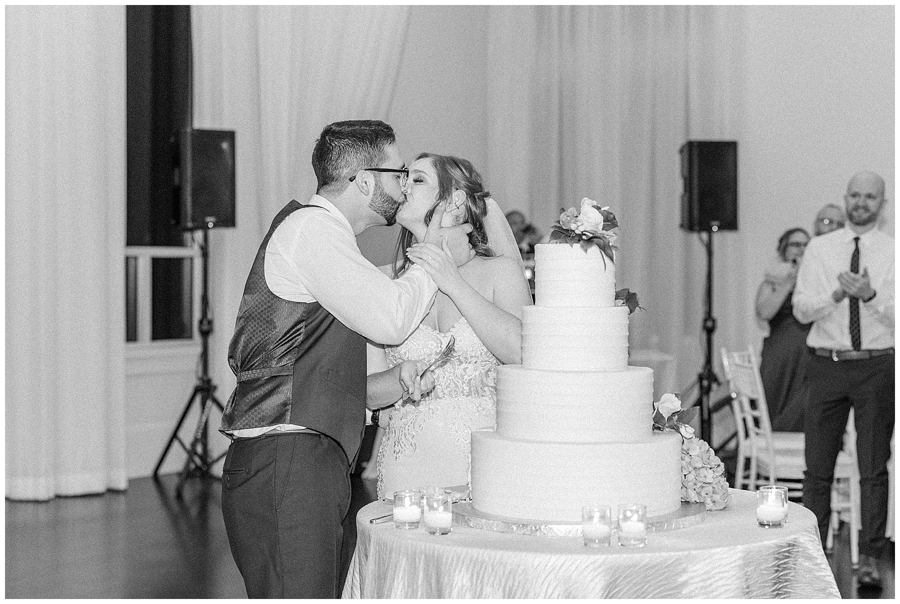 bride and groom cutting cake at MA wedding reception