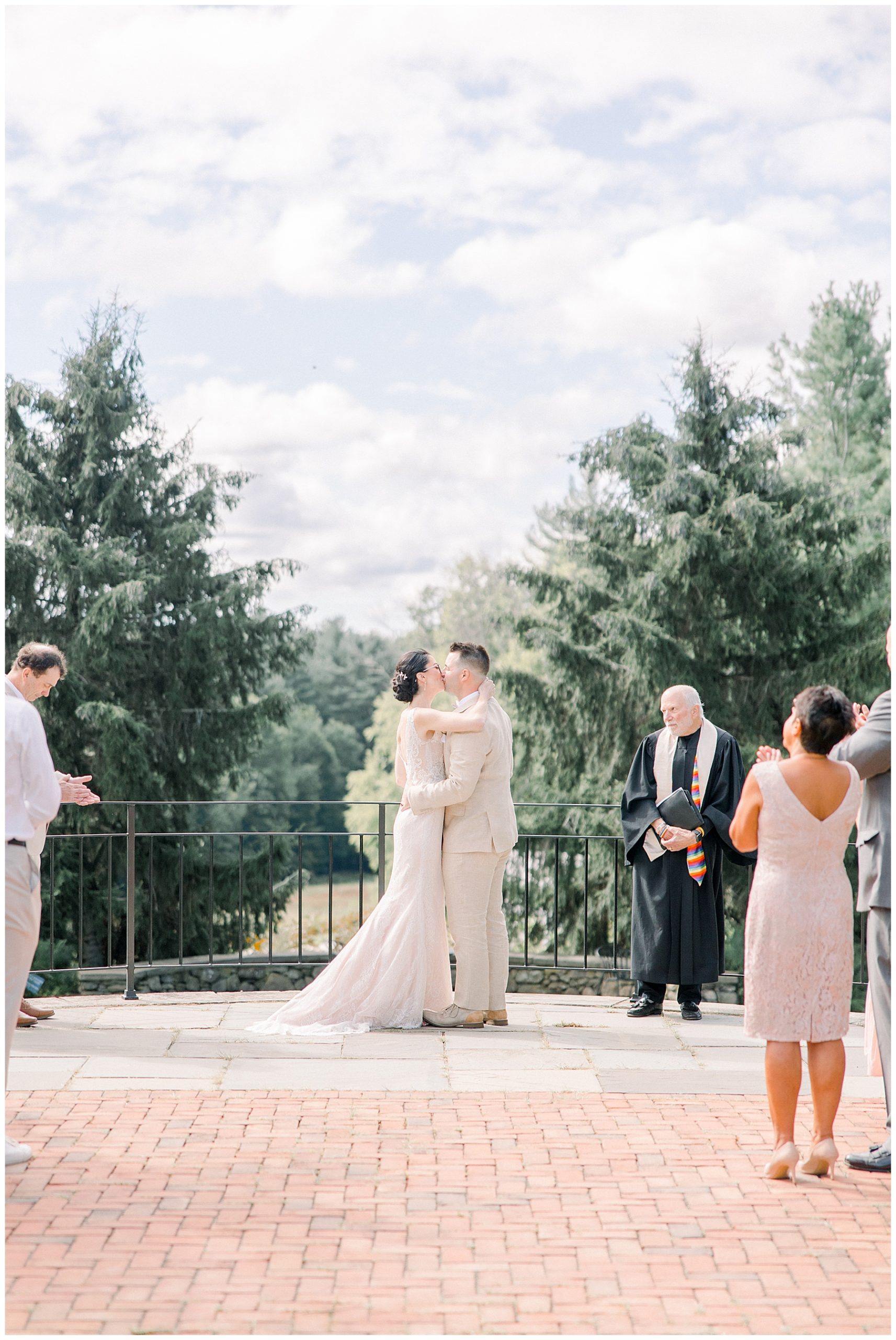 newlyweds kiss at the altar of Tower Hill Botanic Garden Wedding