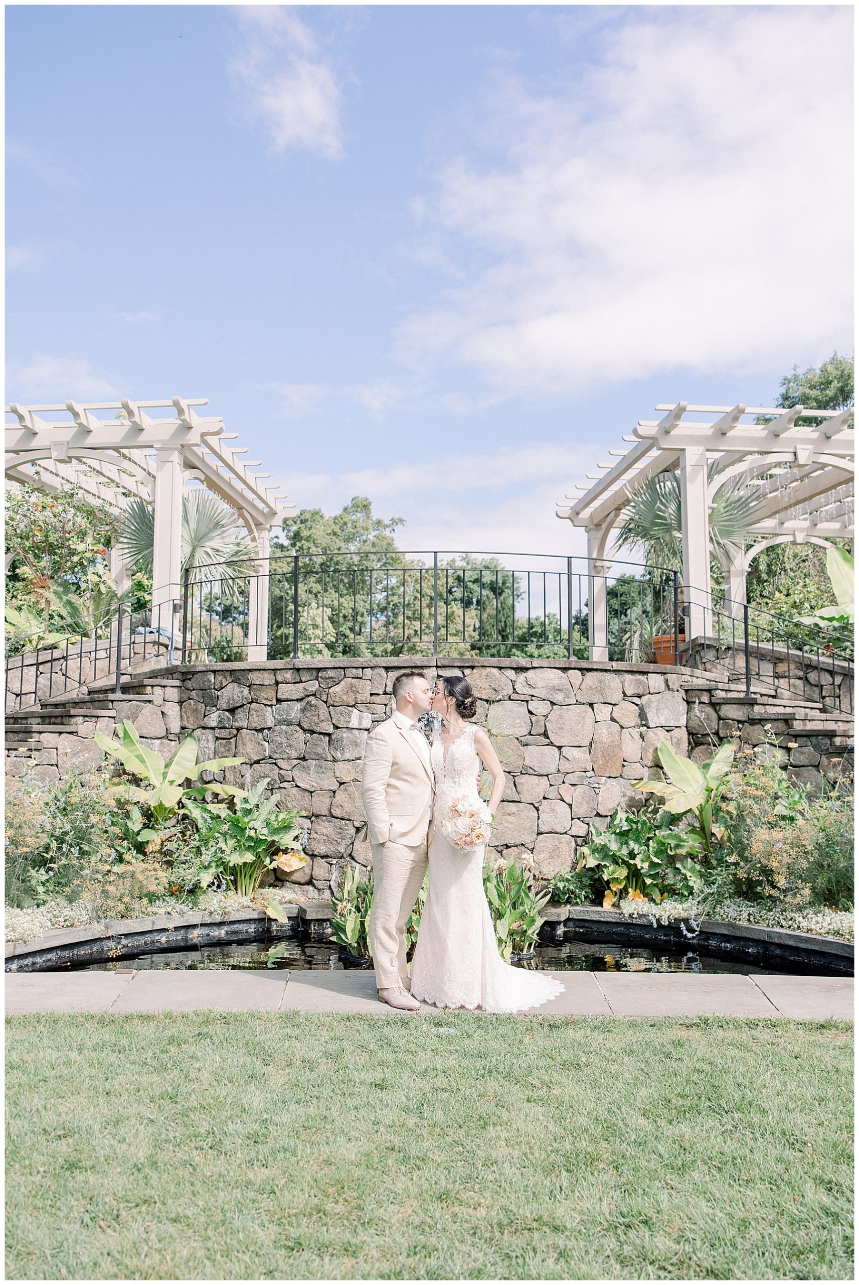 couple kiss after their Tower Hill Botanic Garden intimate Wedding