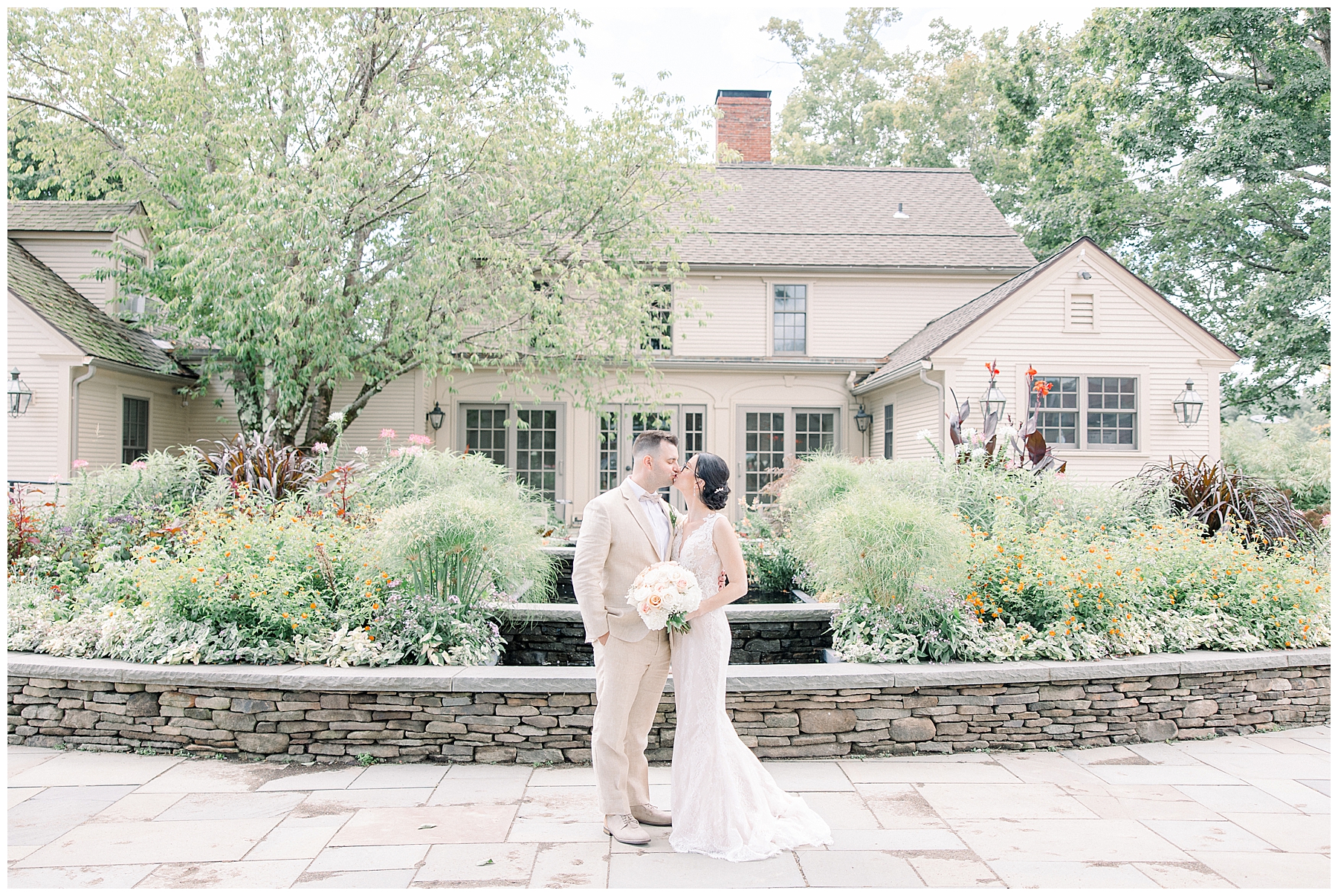 bride and groom in front of building during portraits 