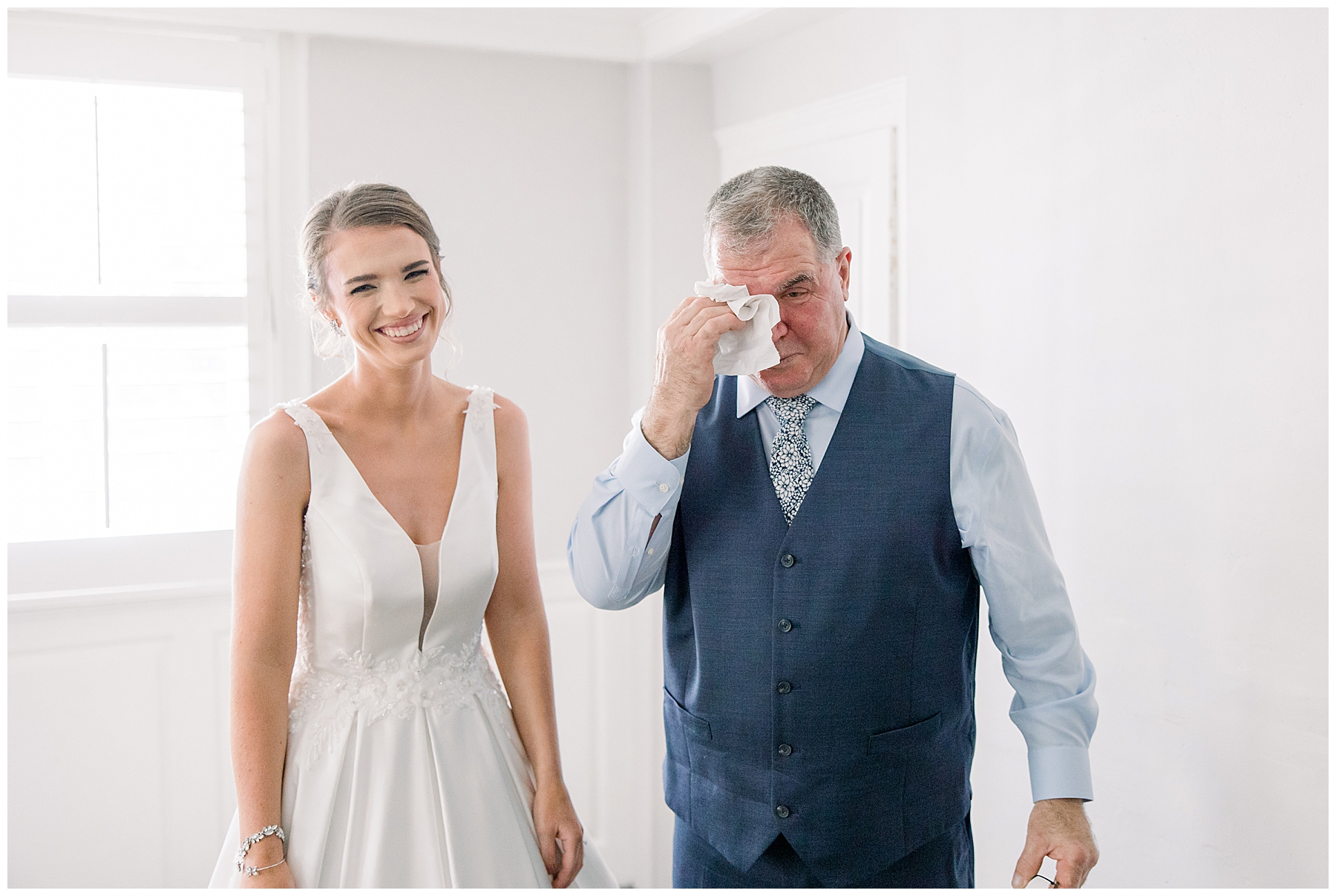 dad wiping away tears after seeing daughter