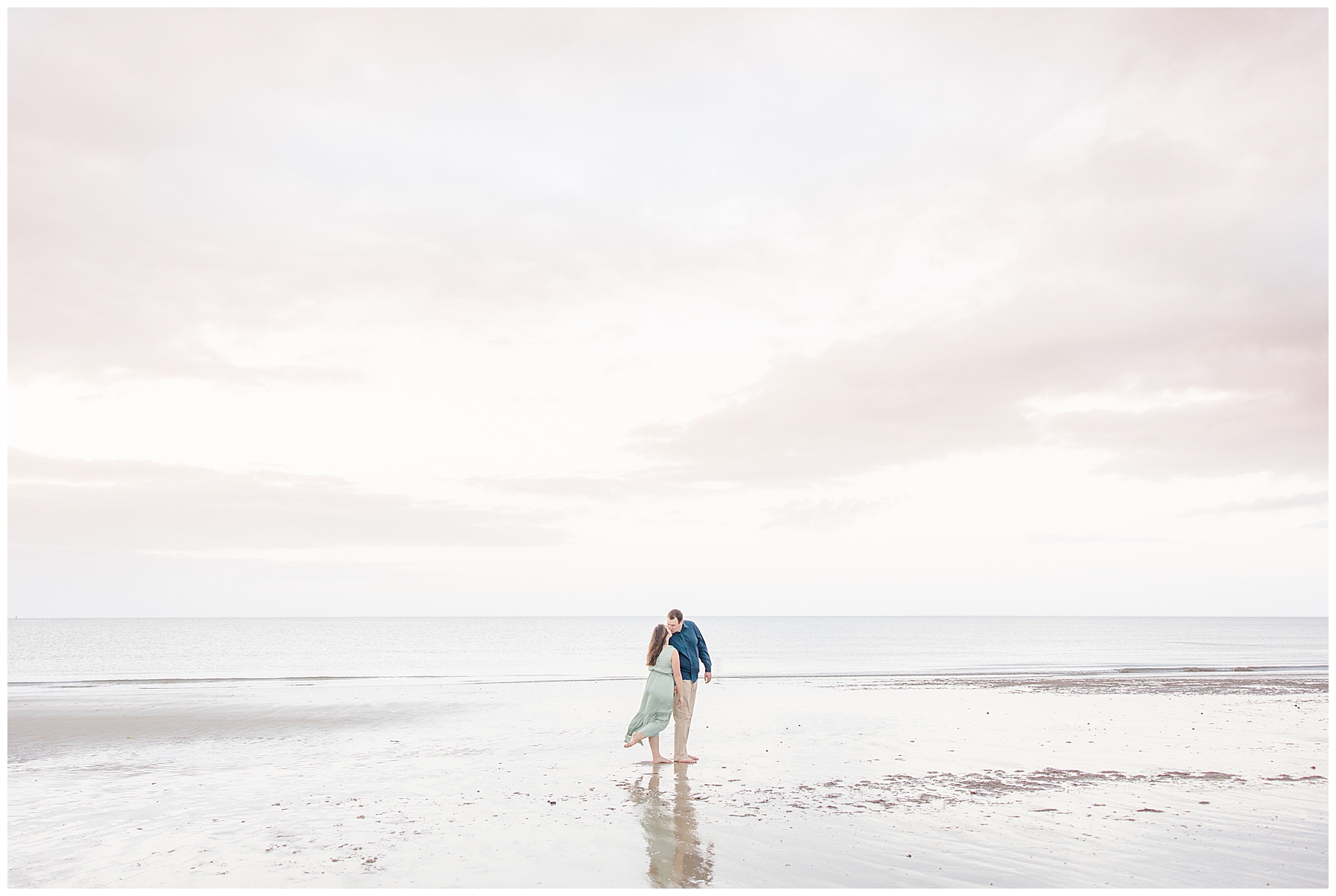 newly engaged walking on beach in Cape Cod MA during engagement photos