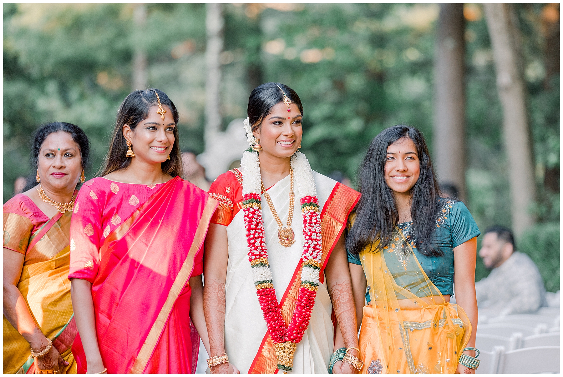 bride with two women at ceremony
