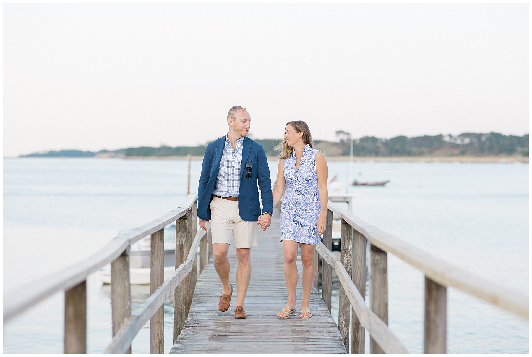 couple walking on dock at Cape Cod Engagement Session at Wequassett Resort and Golf Club 