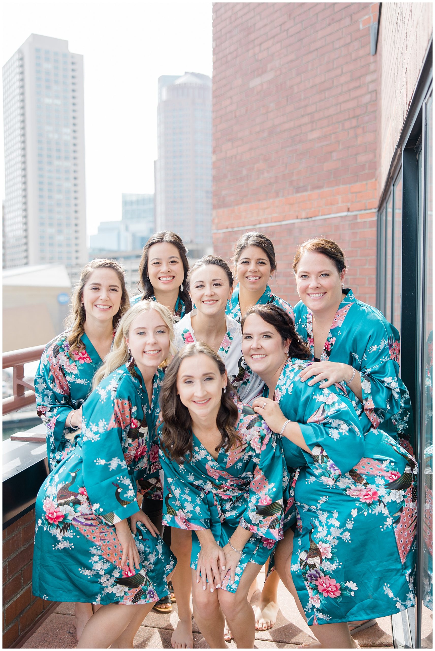 bride and bridesmaids in matching robes before wedding
