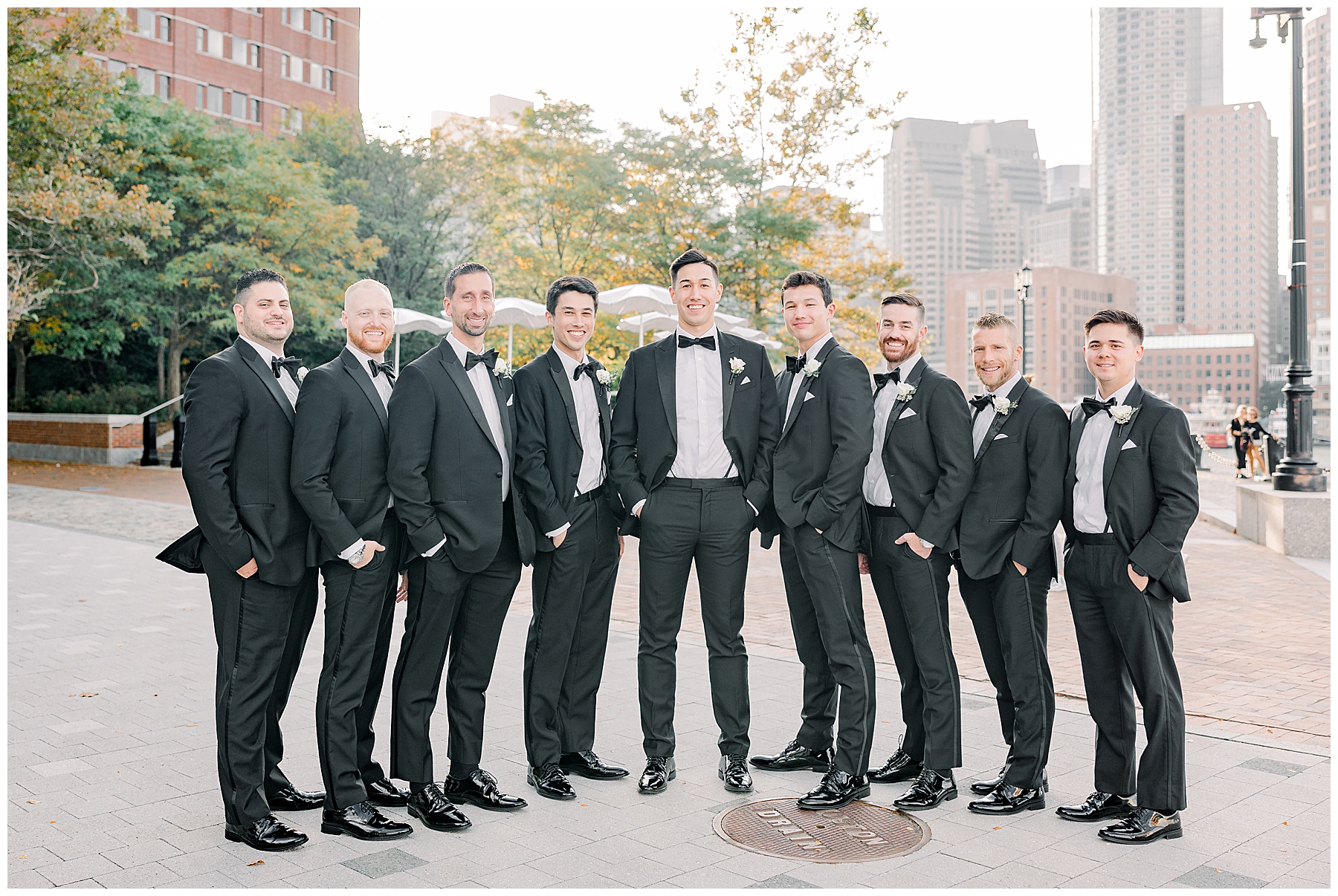 Groom and Groomsmen stand together after wedding ceremony