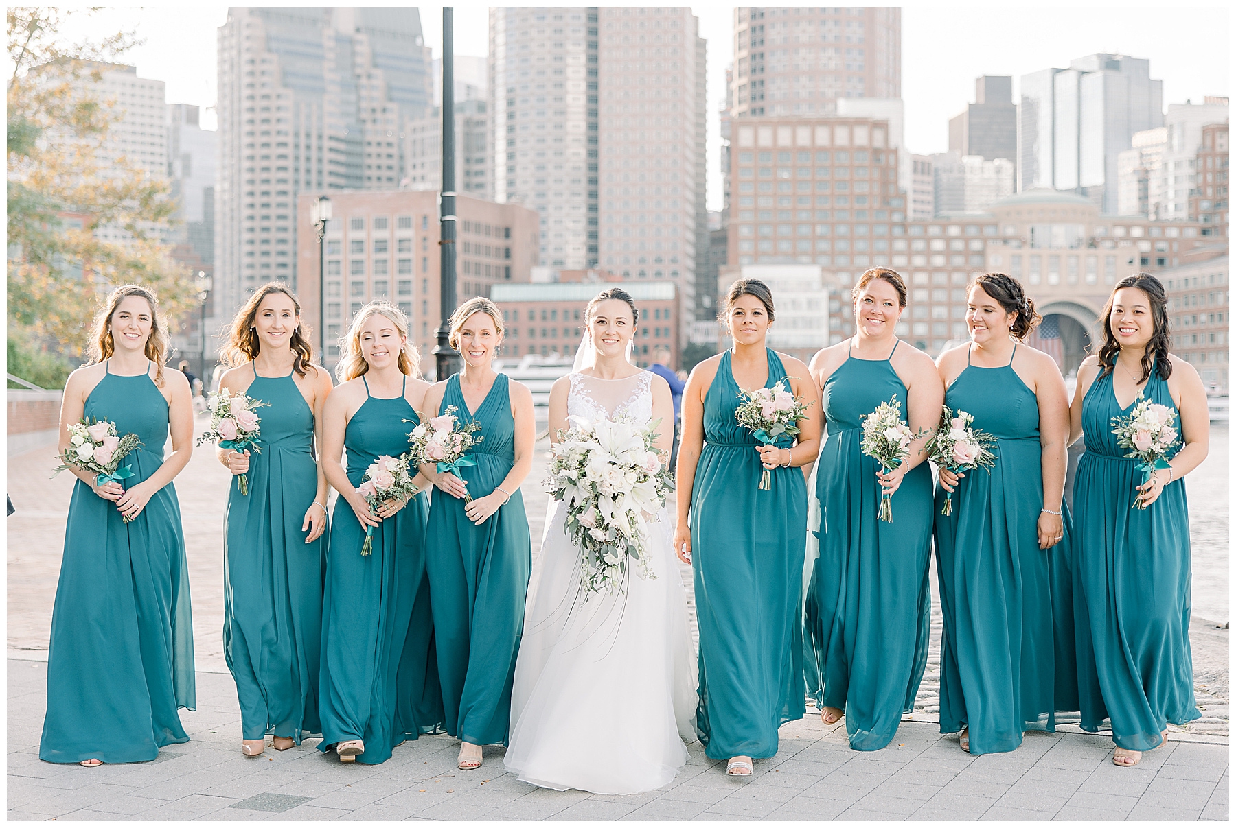 bride and bridesmaids in teal dresses
