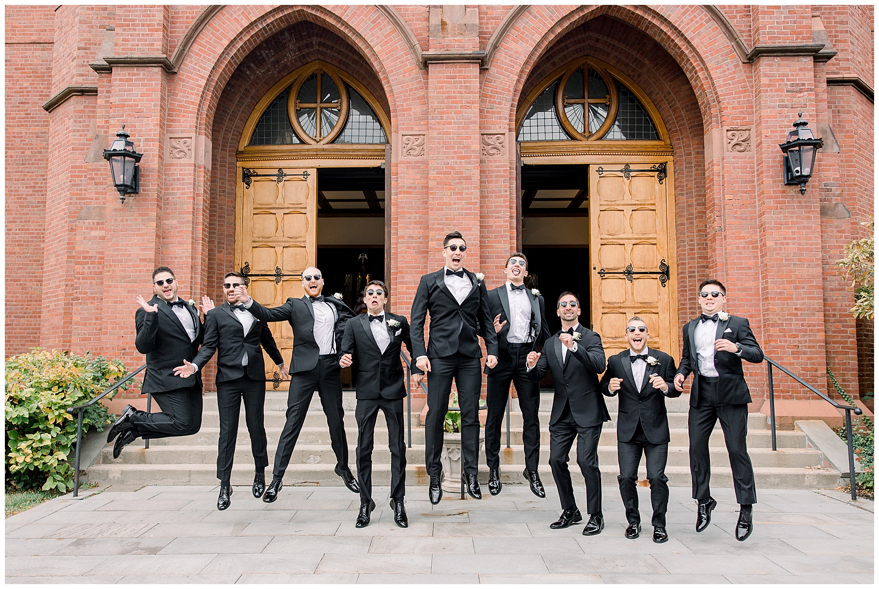 groomsmen and groom jumping up for fun shot