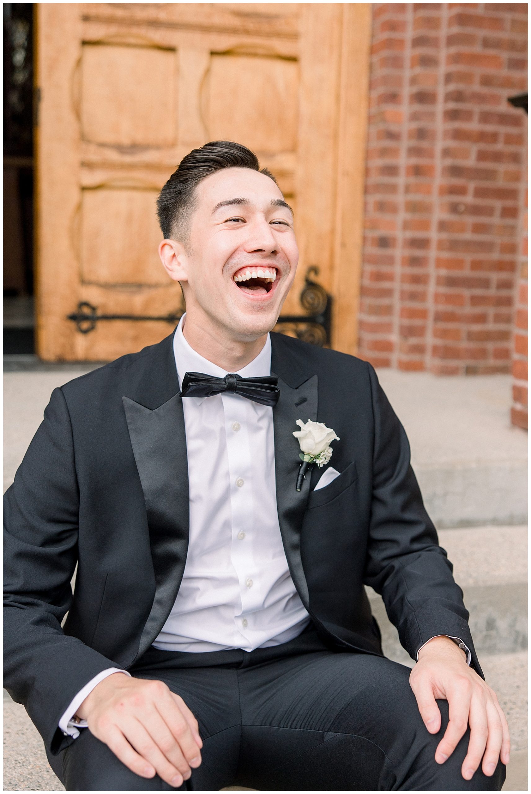 groom laughing at Boston Marriott Long Wharf Wedding