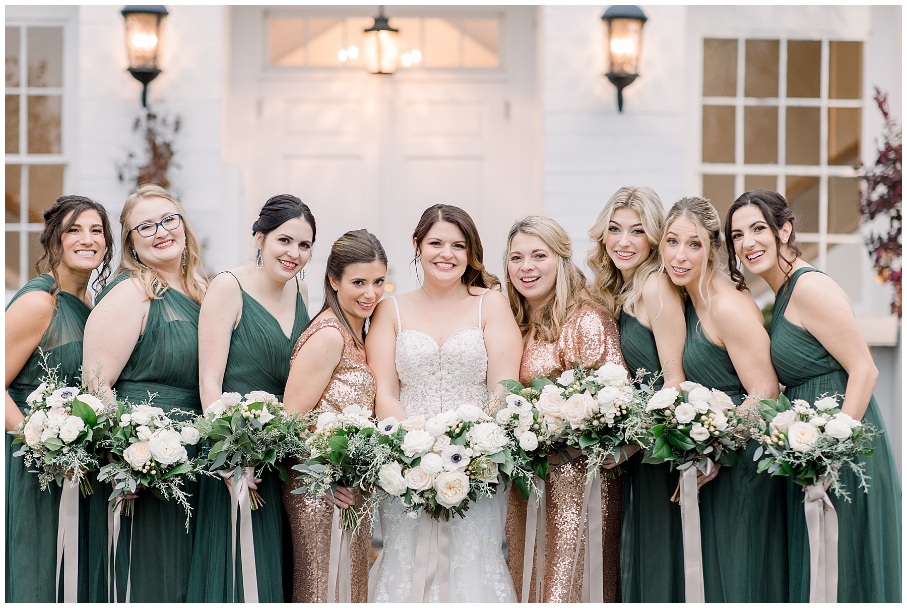 bride with her bridesmaids holding white bouquets