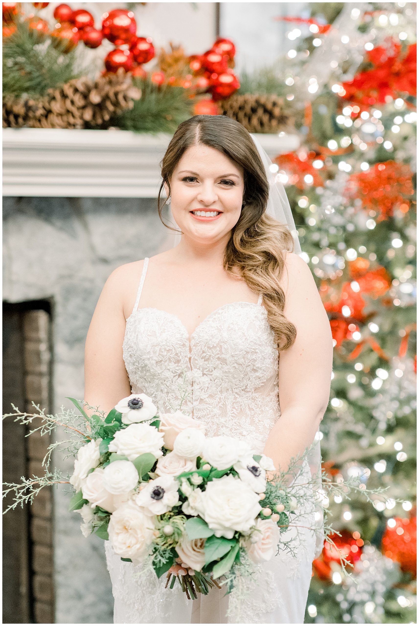 bride in front fireplace decorated for Christmas