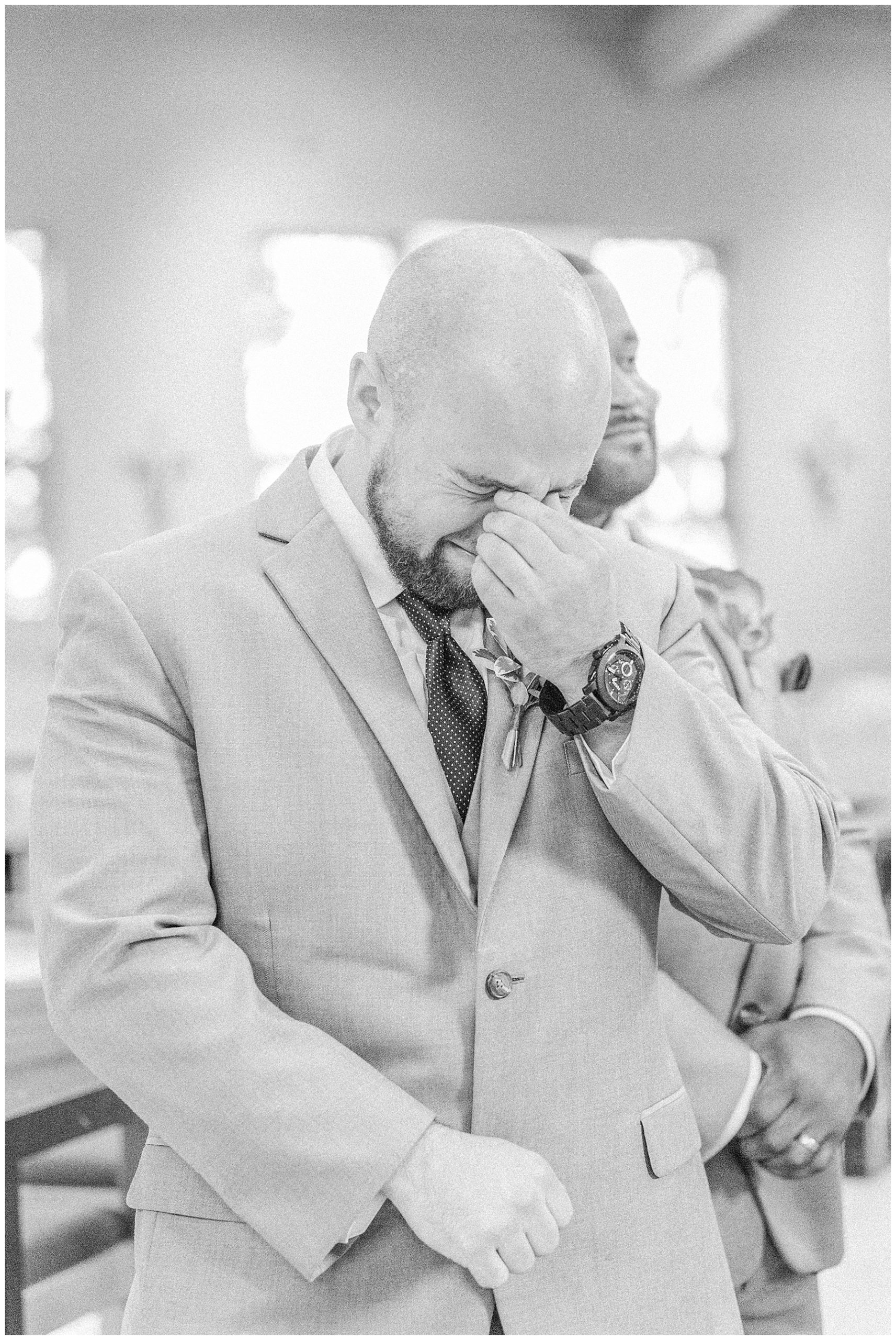 groom tears up at the sight of his bride