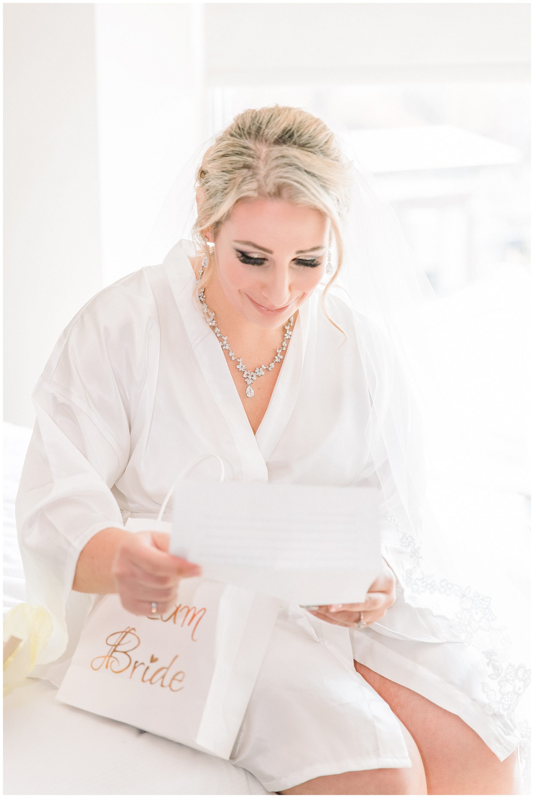bride reads letter from groom before wedding ceremony