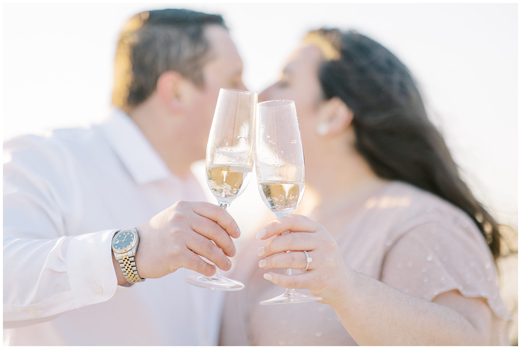 couple toasts champagne on the beach in Cape Cod
