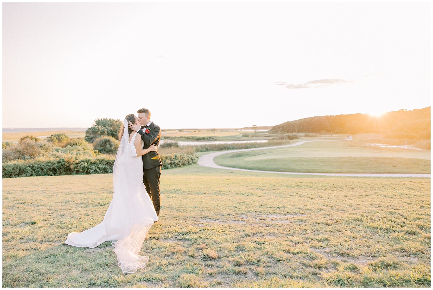 newlyweds at sunset on the grounds of Club at New Seabury 