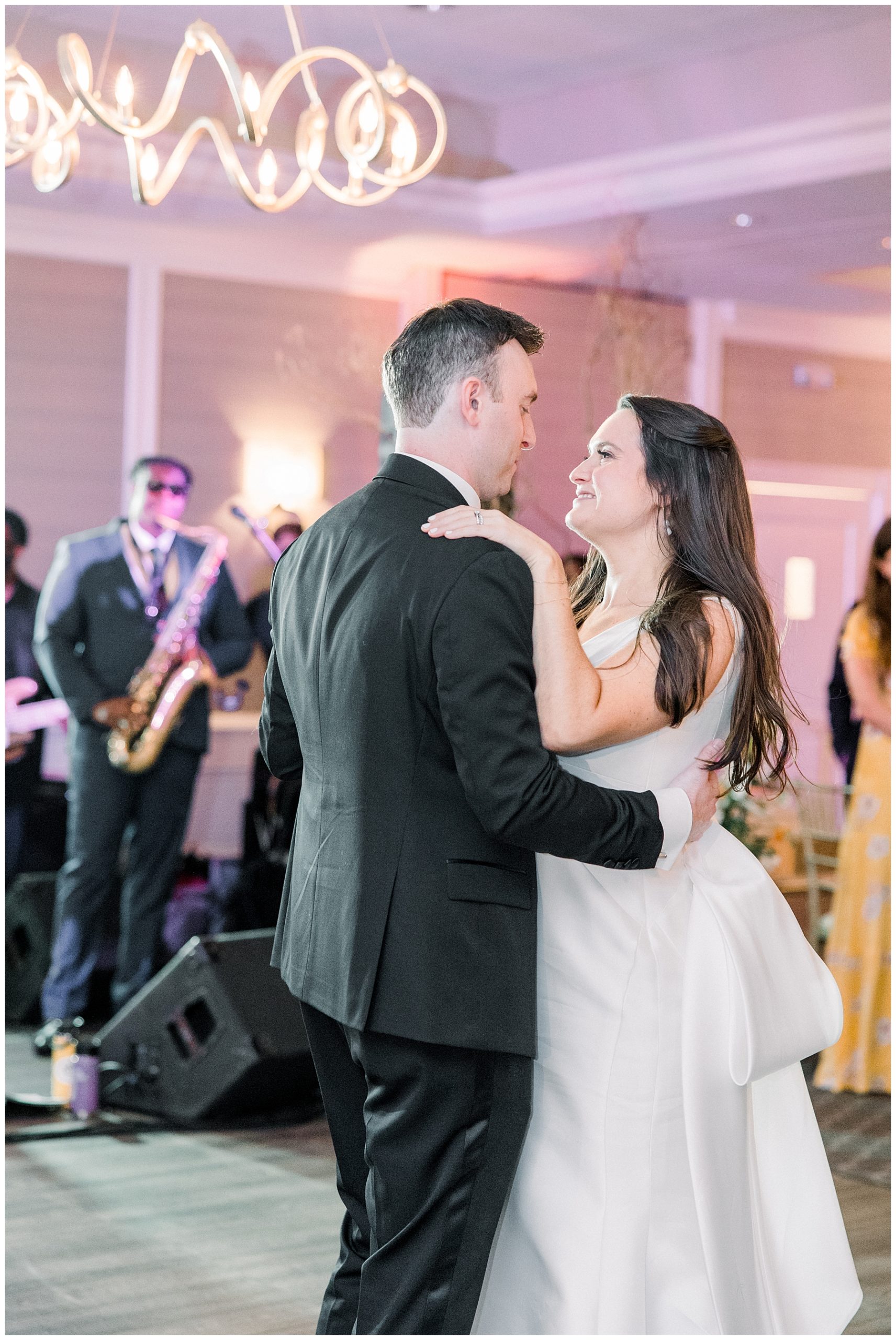 newlyweds dance together as husband and wife 
