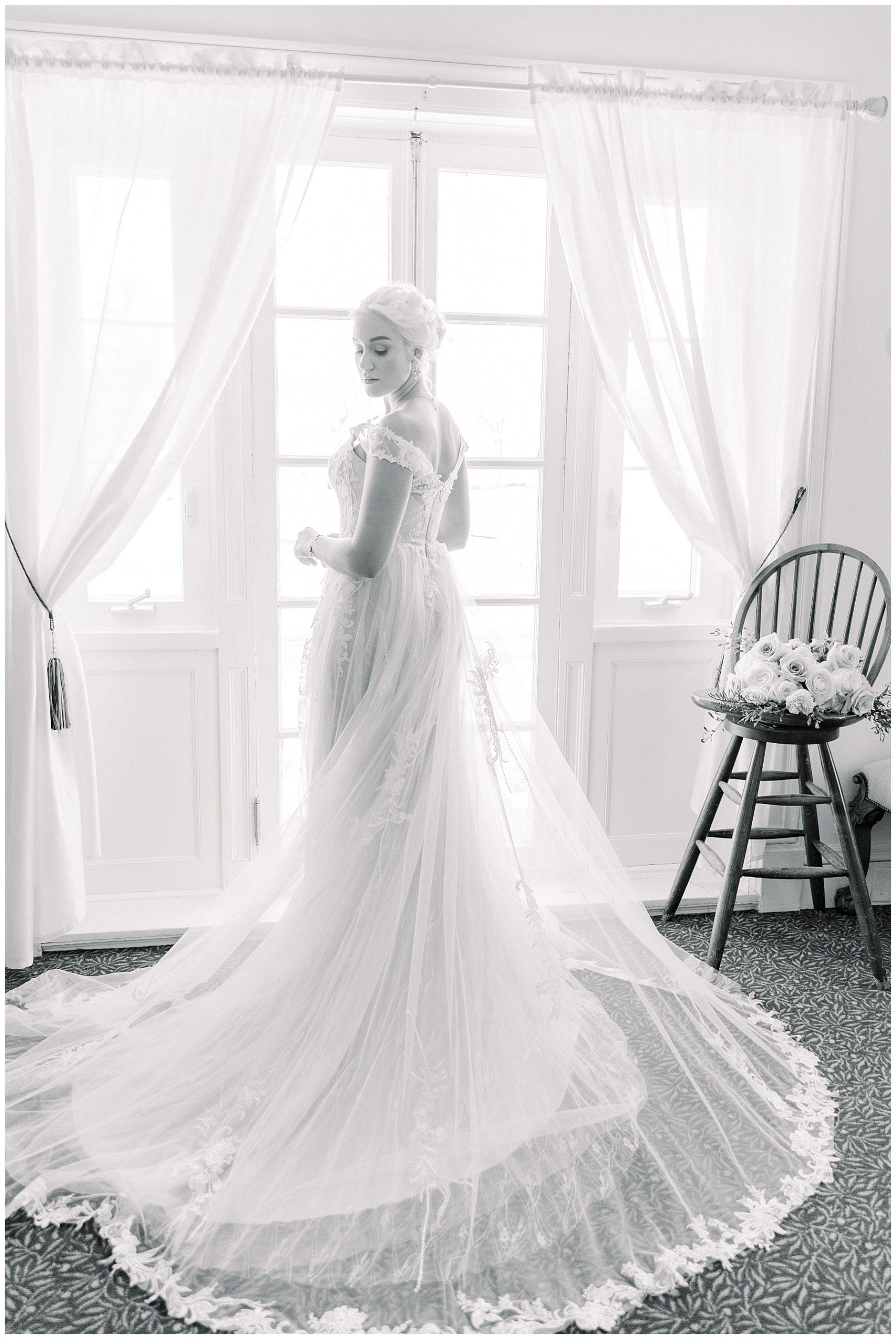 bride standing by window at Tupper Manor Wedding 