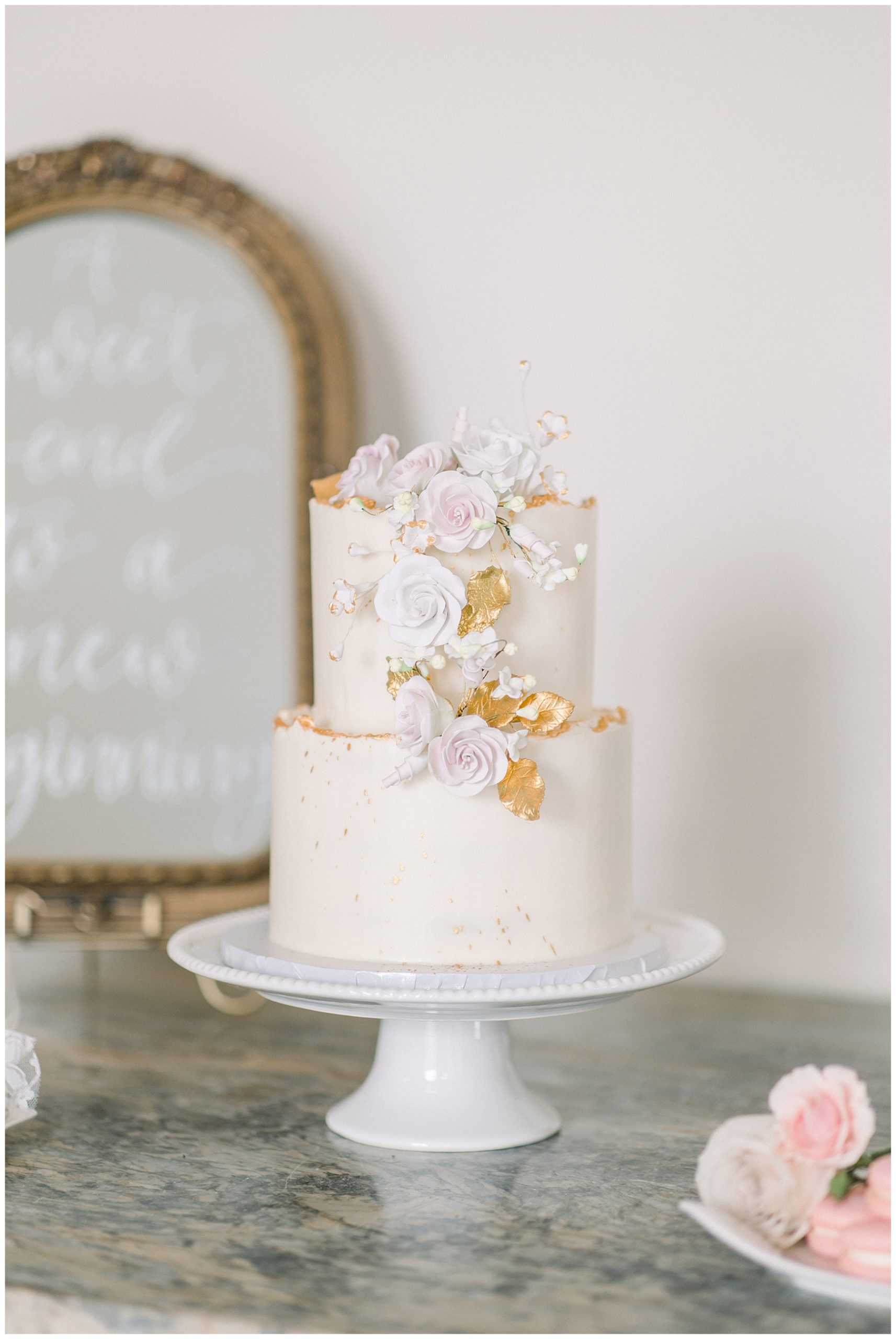 beautiful gold trimmed wedding cake 